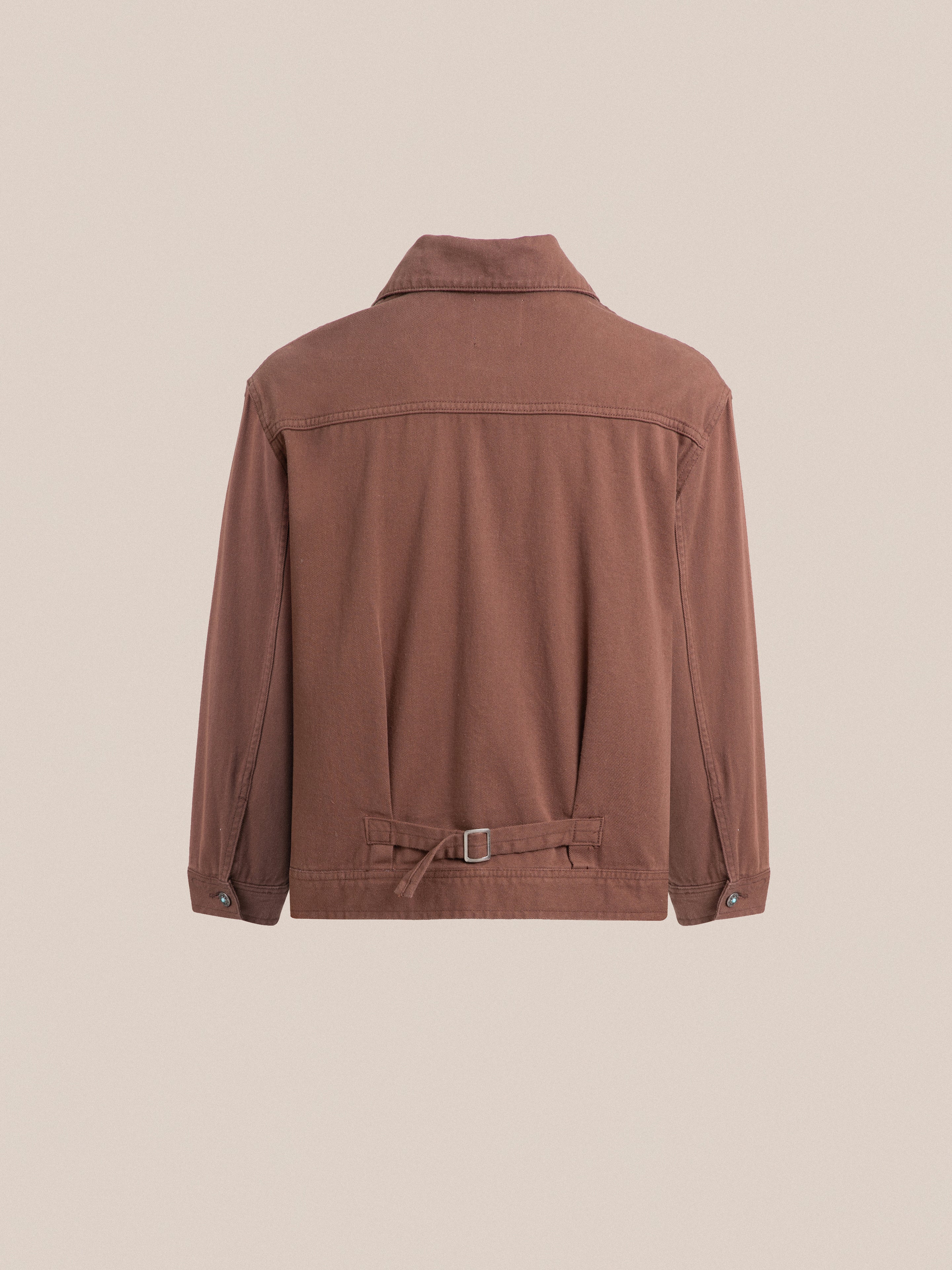 The back view of a brown Found Dusky Western Trucker Jacket.