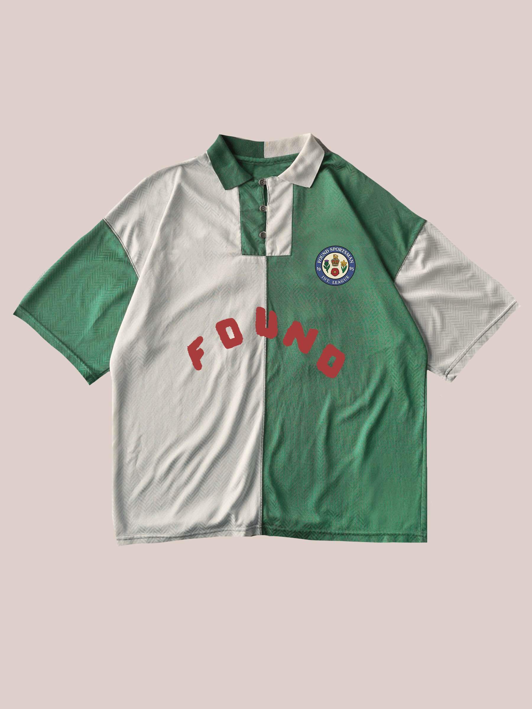 The FOUND Color Block Regent Jersey is a green and white unisex polo with “FOUND” text on the front and a soccer ball patch on the chest, offering classic vintage sportswear style.