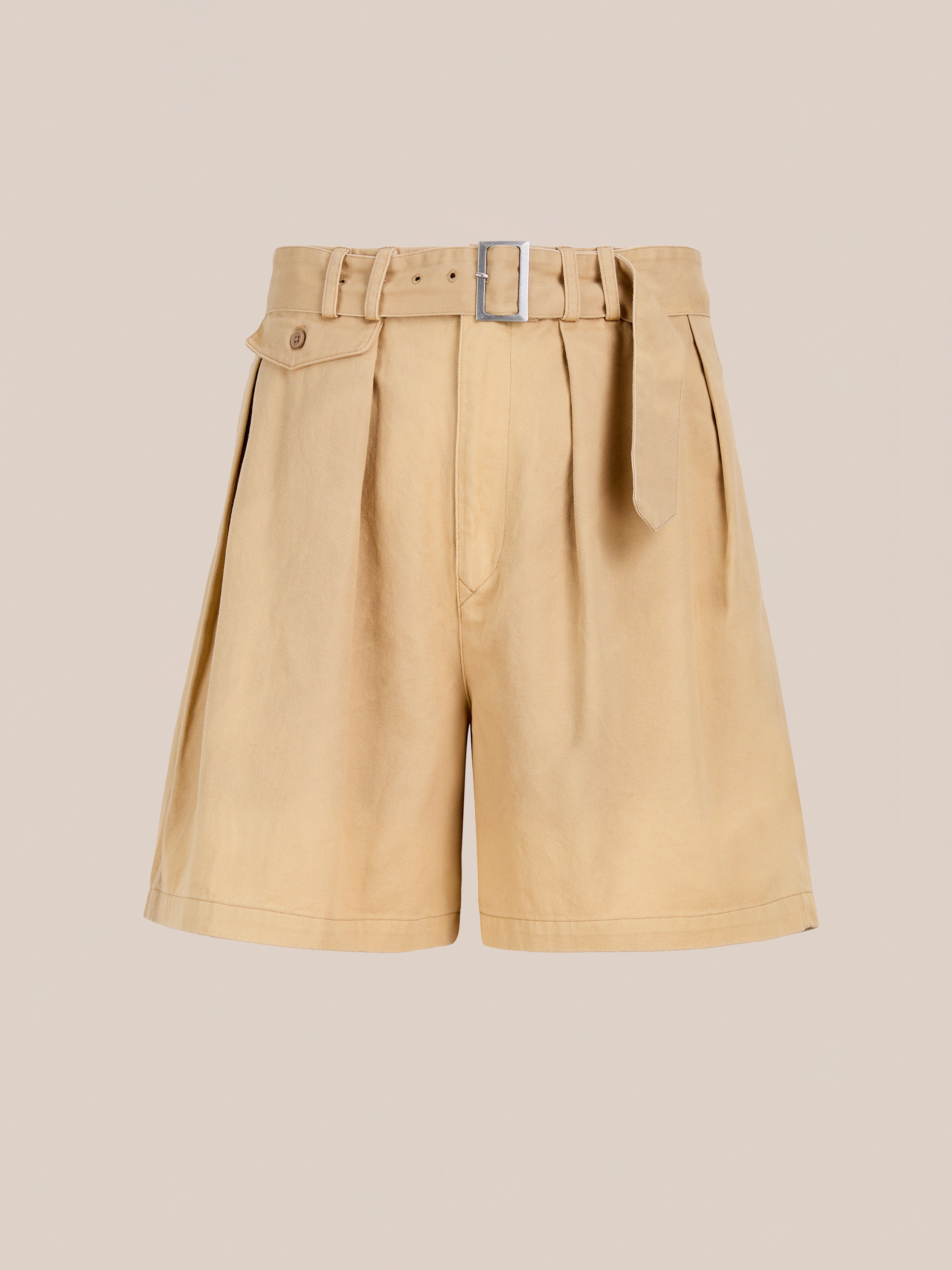 Found’s Belted Twill Pleated Shorts feature chic pleats, a belted waist, and side button detail in tan twill—utility style displayed against a plain beige background.