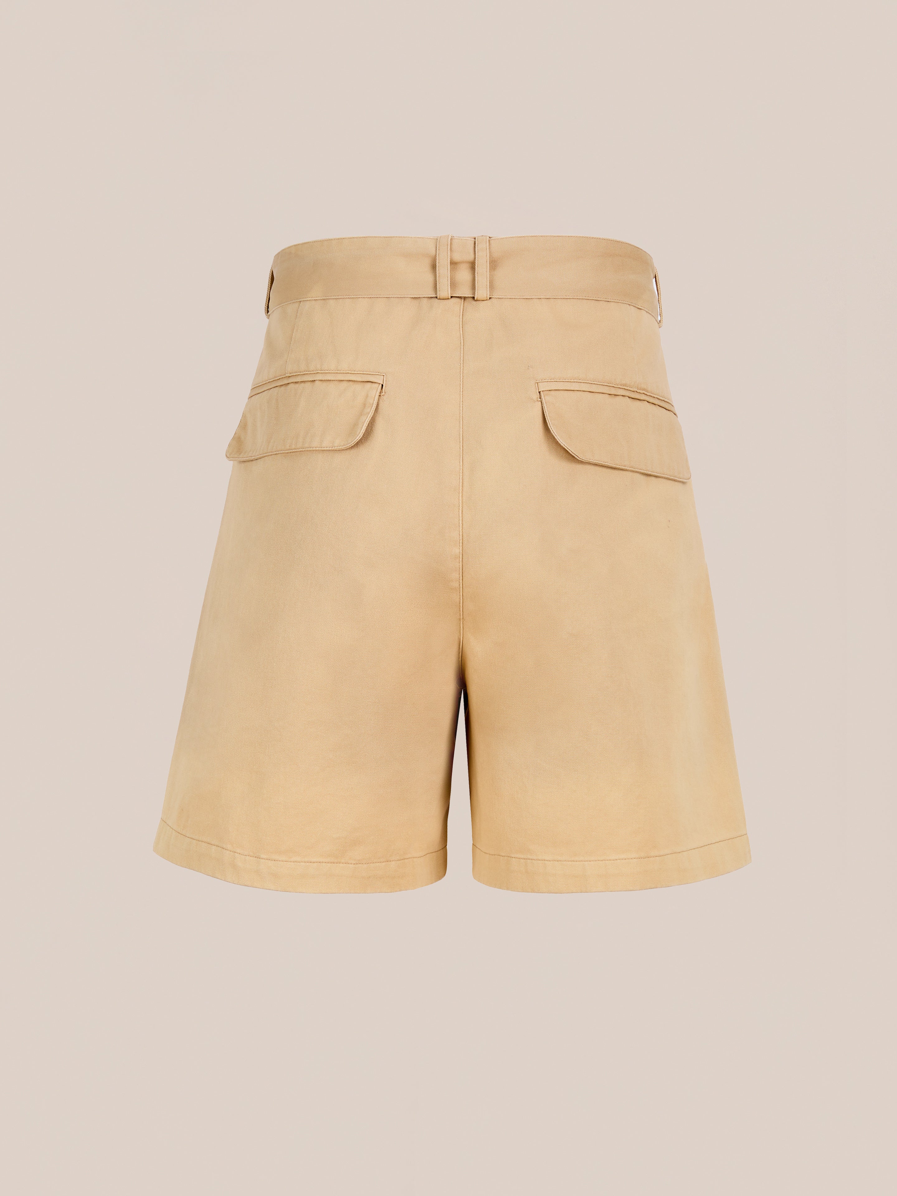 Found Belted Twill Pleated Shorts in beige, featuring a high waist, belt loops, and two back flap pockets, are shown against a plain light background.