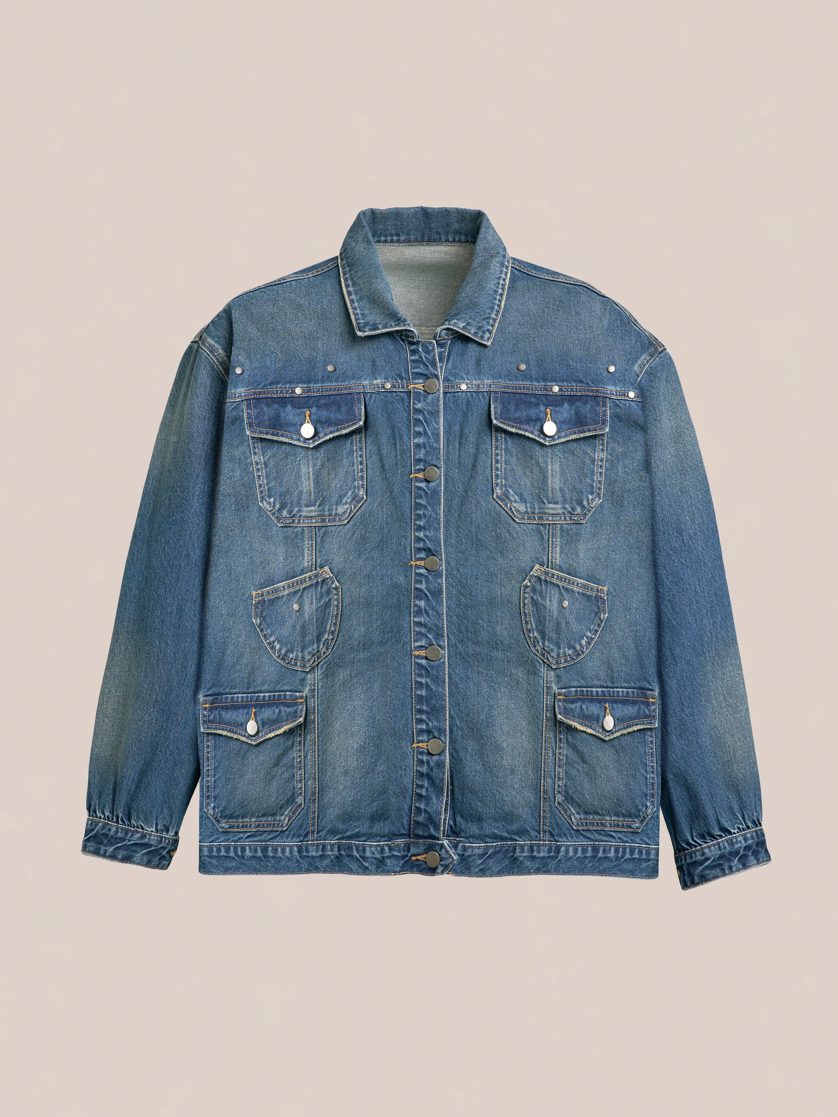 The FOUND Denim Carpenter Jacket, in blue, offers a front view featuring a collar, button closure, and four buttoned front pockets on a plain background. Ideal for workwear enthusiasts desiring style and functionality. Unisex design included.