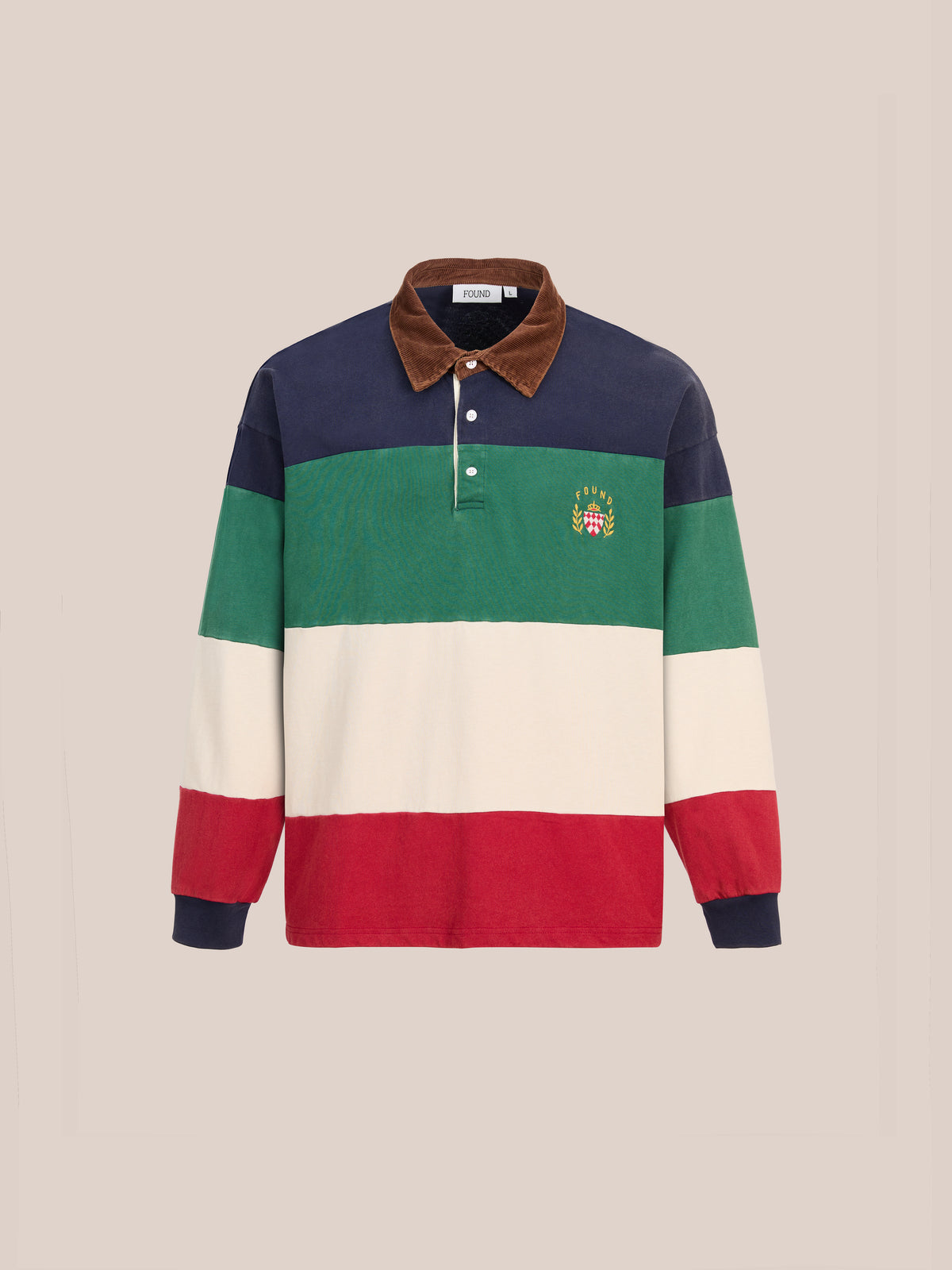 The Crestfield Rugby by FOUND is a long-sleeve vintage rugby shirt featuring wide horizontal stripes in navy, green, cream, and red, a brown collar, and a small embroidered crest on the left chest.