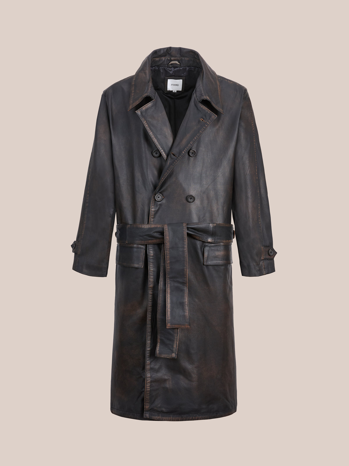 The FOUND Belted Leather Trench Coat in brown features notch lapels, buttoned cuffs, and a double-breasted, ethically crafted design for any wardrobe.