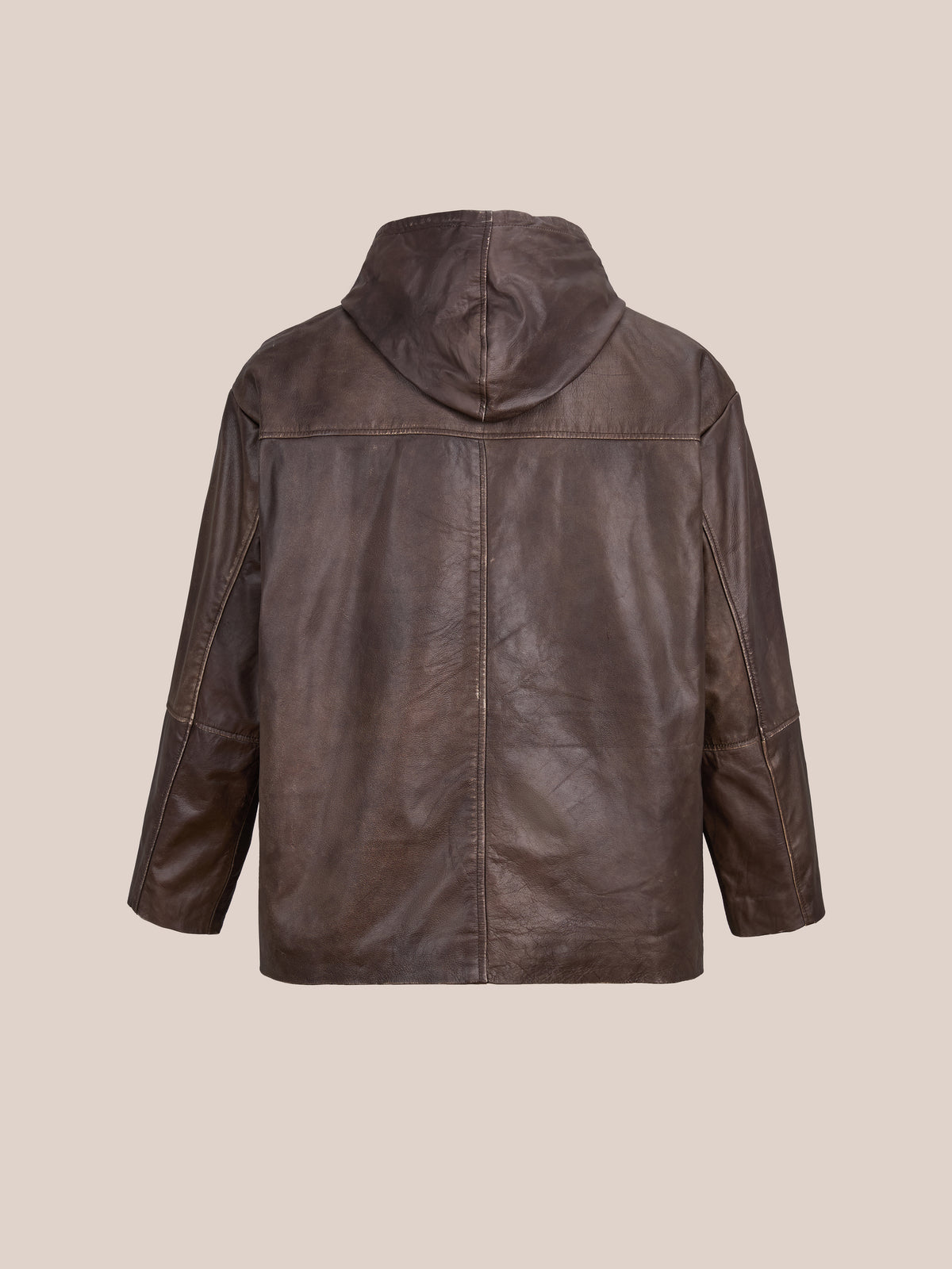 The FOUND Double Layer Leather Hooded Jacket is shown from the back against a plain light beige background, highlighting its brown leather construction and unique double layer design.