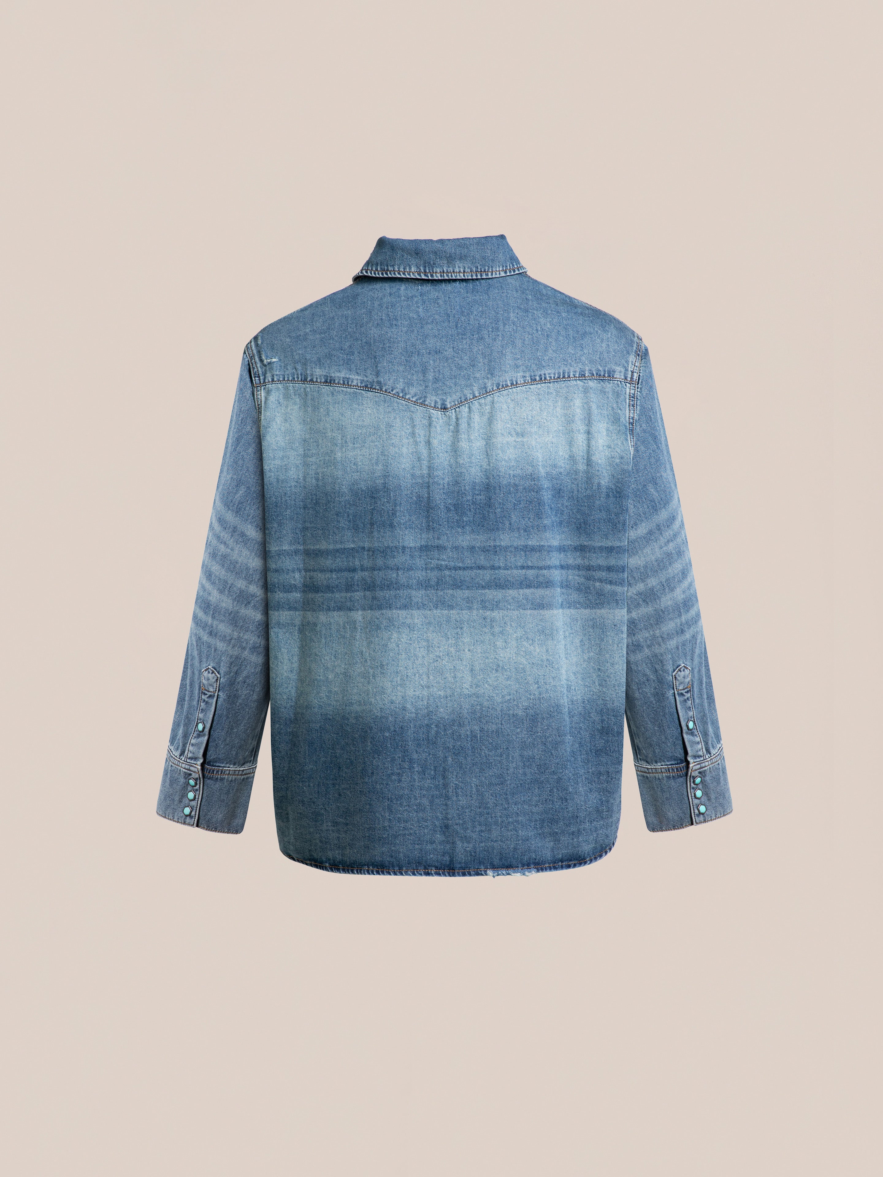 Back view of the FOUND Floral Embroidered Western Denim Shirt in blue, featuring long sleeves, buttoned cuffs, and a yoke detail.