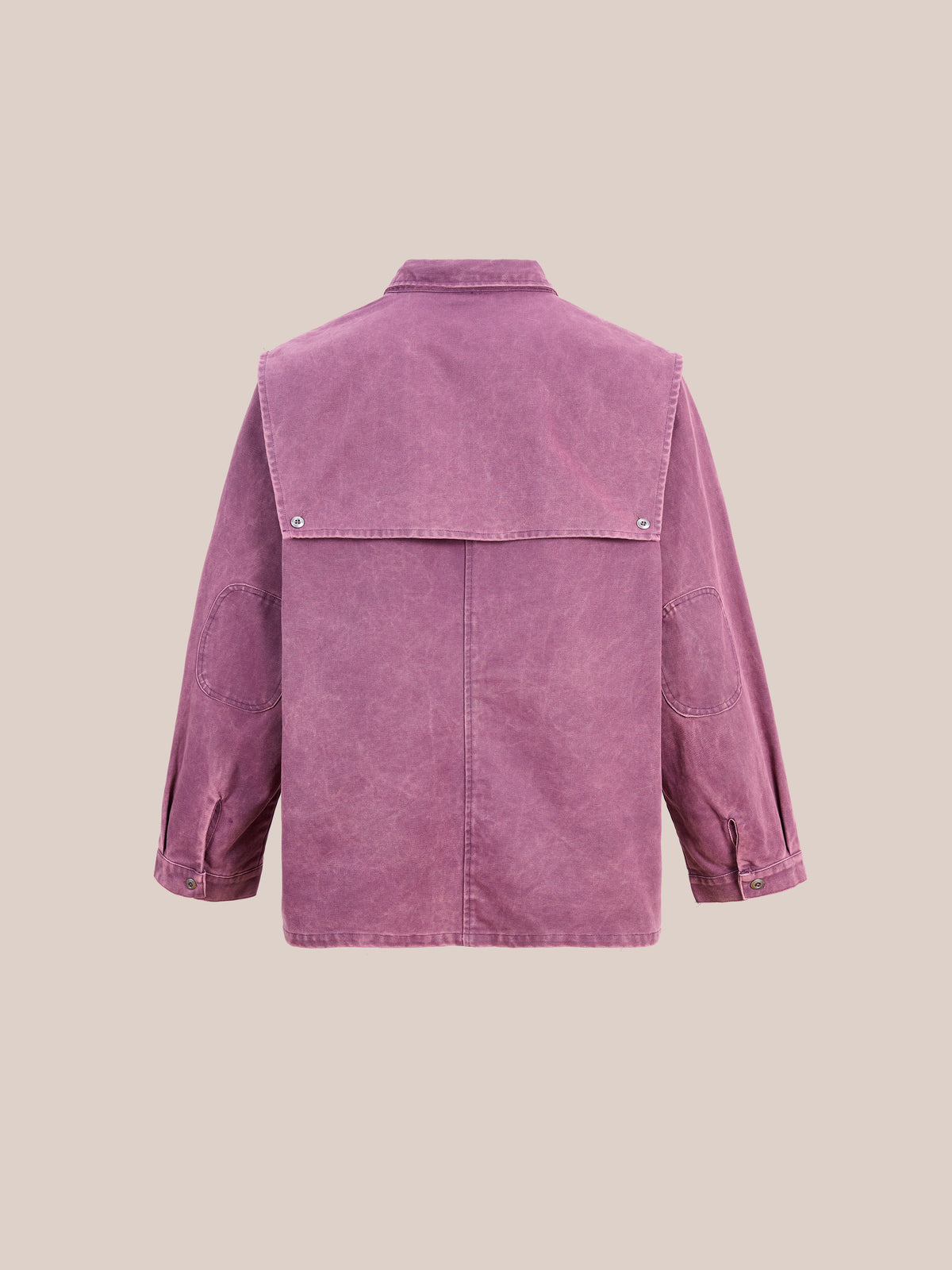 Back view of the Found Faded Paneled Cargo Jacket, a garment-dyed mauve corduroy piece featuring a large yoke, long sleeves, and buttoned cuffs, designed in a unisex relaxed fit and displayed against a plain beige background.