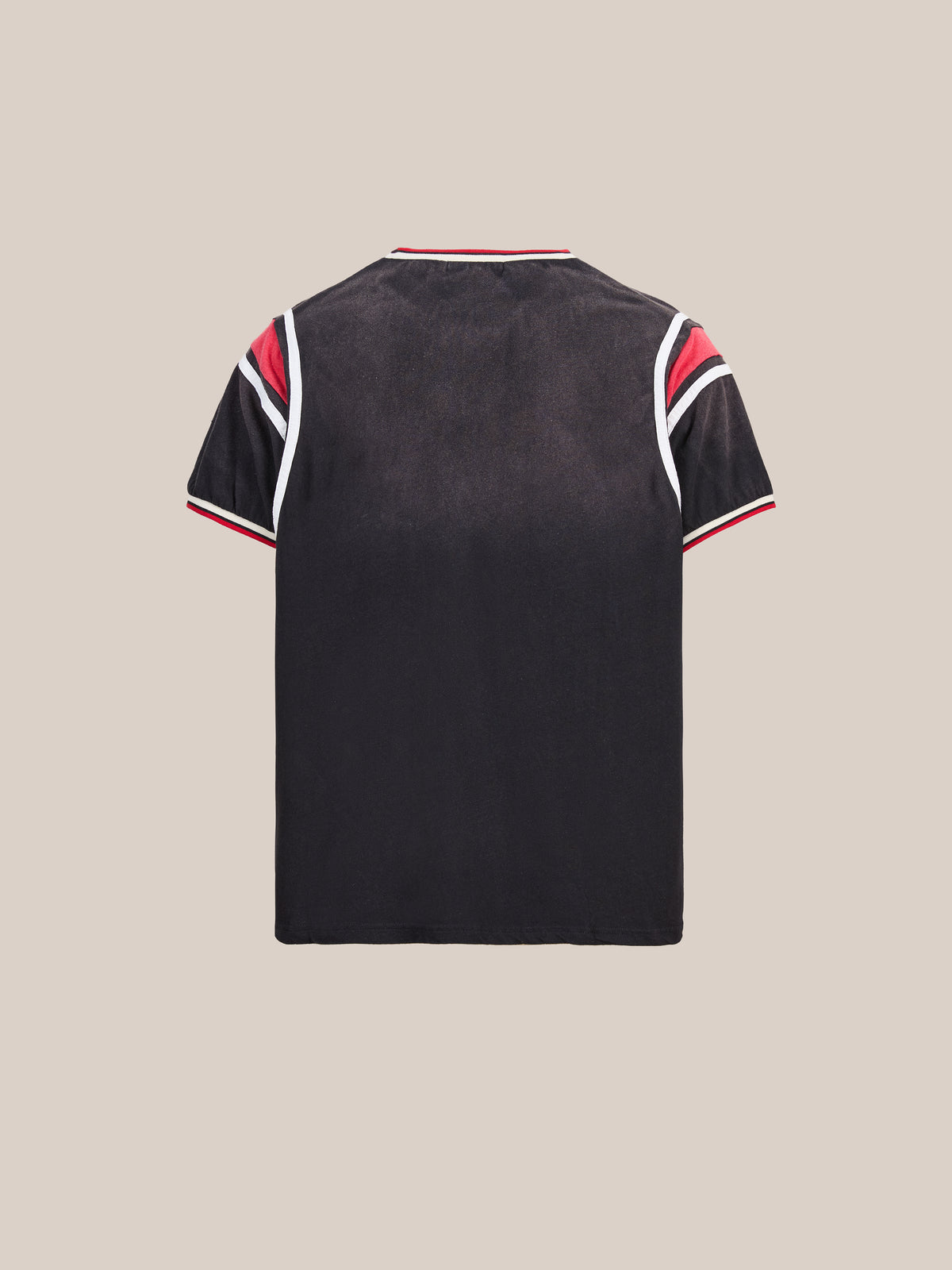 The FOUND Foundation Practice Jersey is a black short-sleeve shirt shown from the back, featuring white and red stripes on the sleeves and collar for a true vintage athletic jersey look inspired by retro sportswear style.
