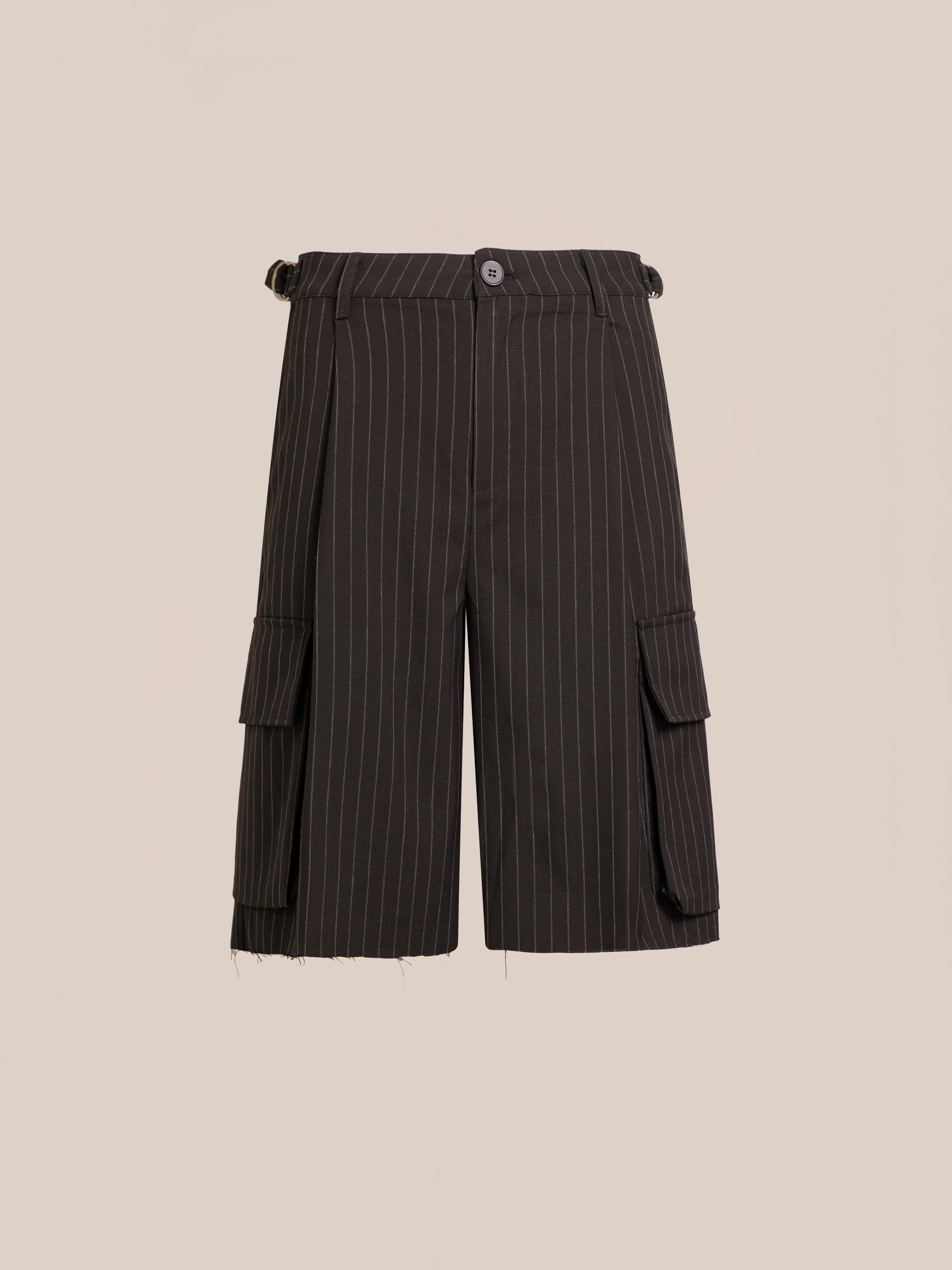 The FOUND Hava Pinstripe Pleated Cargo Trouser Shorts are unisex, featuring side flap pockets, adjustable waist tabs, and a raw-edged hem, shown against a plain beige background.