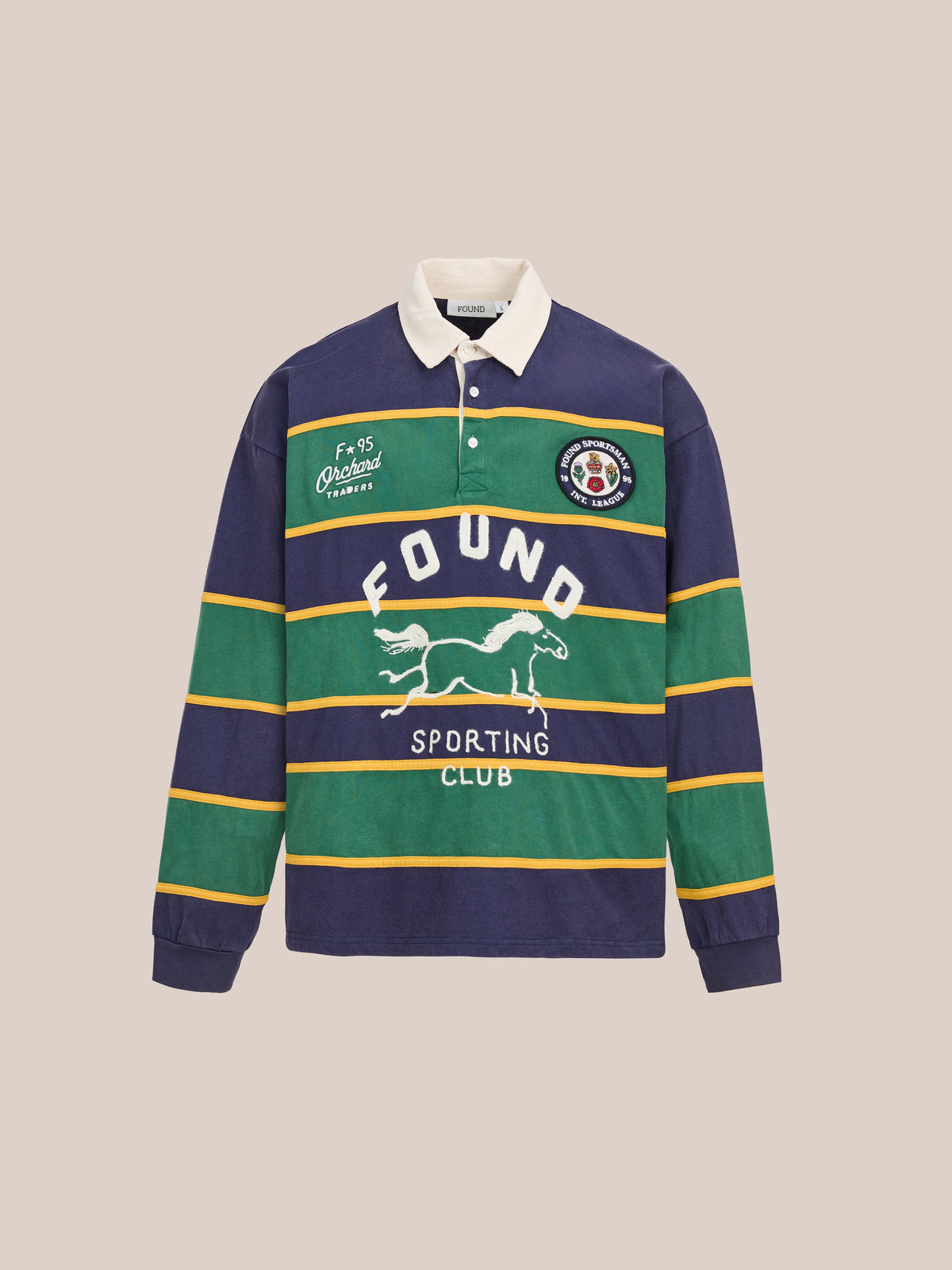 FOUND Horse Logo Rugby: Unisex long-sleeve shirt with navy, green, and yellow stripes, white collar, embroidered patches, and horse logo rugby graphic on front.