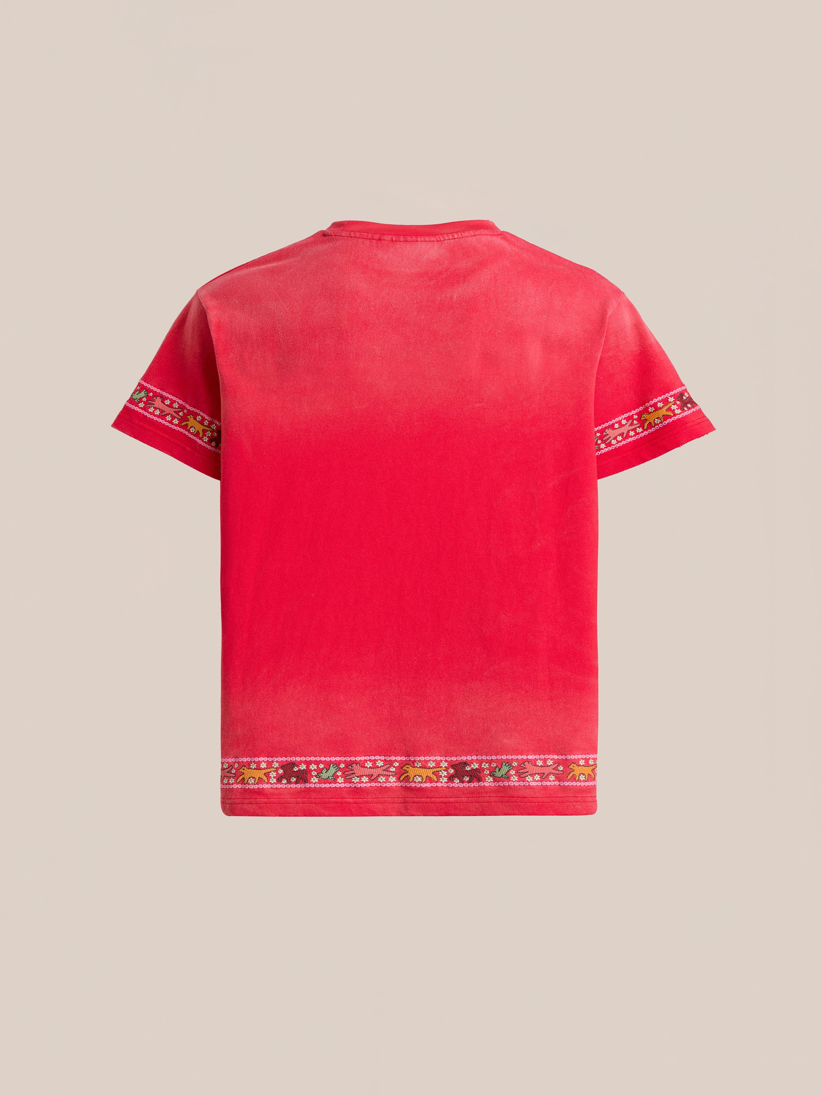 The FOUND Horse Motif Embroidered Tee is a red short-sleeve vintage wash top with a round neck, floral trim on the sleeves and hem, and an embroidered horse motif, pictured against a neutral background.