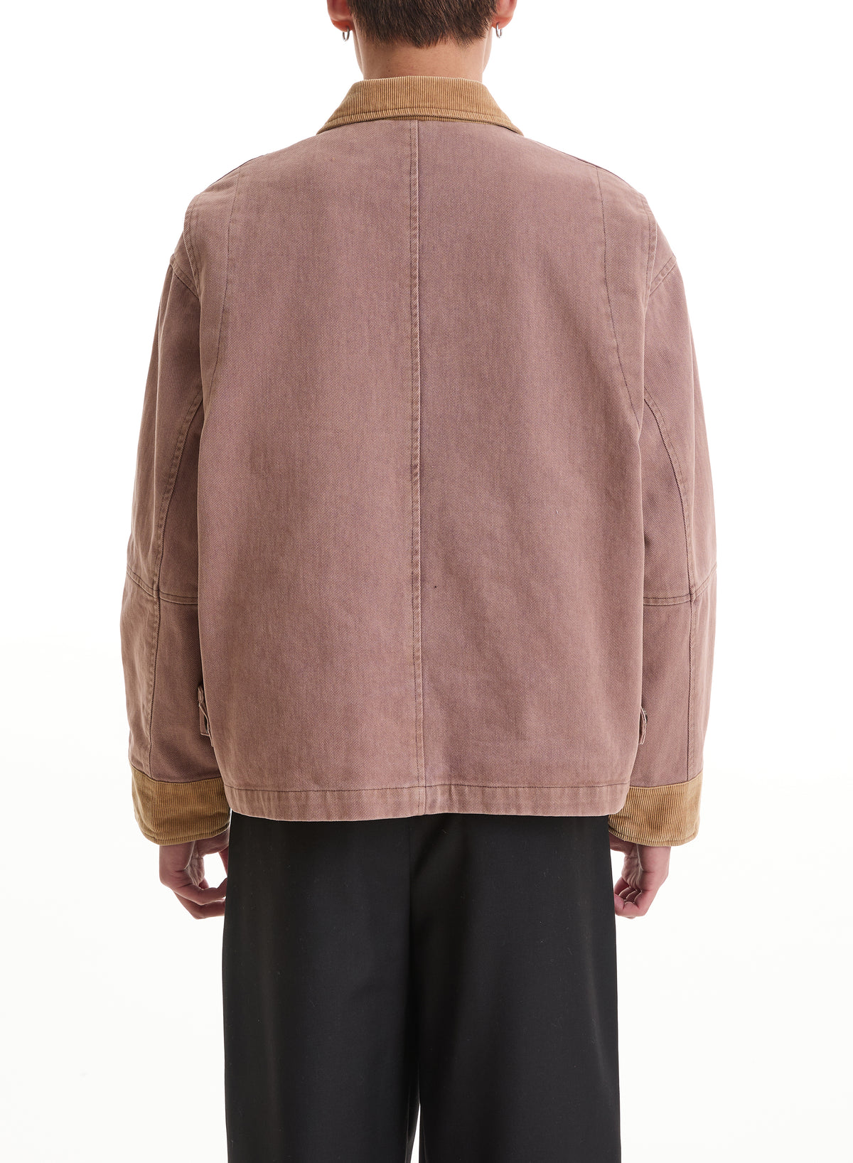 Person wearing the FOUND Horse Crest Work Jacket, a brown cotton twill chore coat with tan collar and cuffs, shown from the back over black pants against a white background.