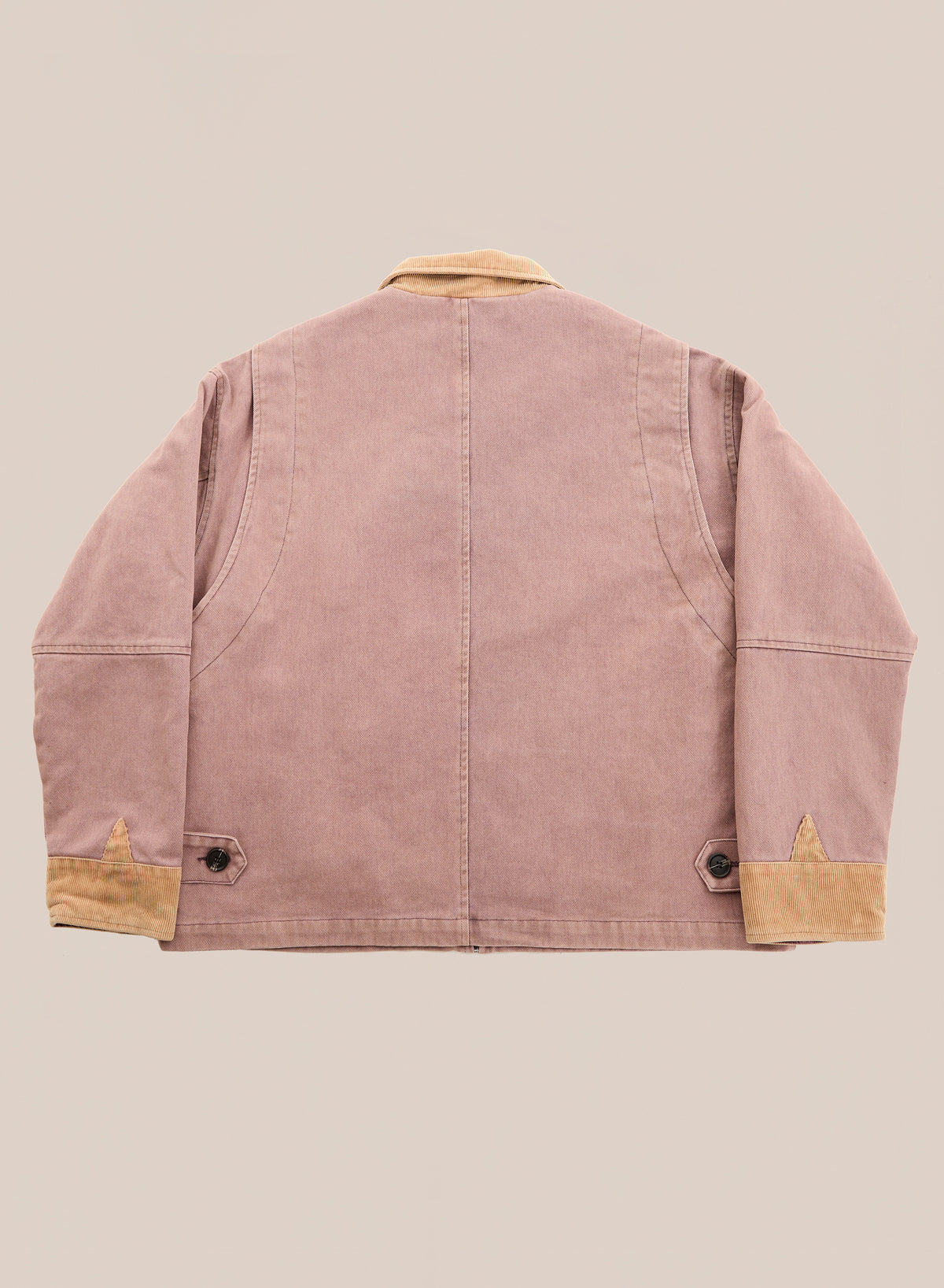 Rear view of the Horse Crest Work Jacket by FOUND in light brown cotton twill with tan collar, cuffs, buttoned wrists, and back waist adjusters on a neutral background.