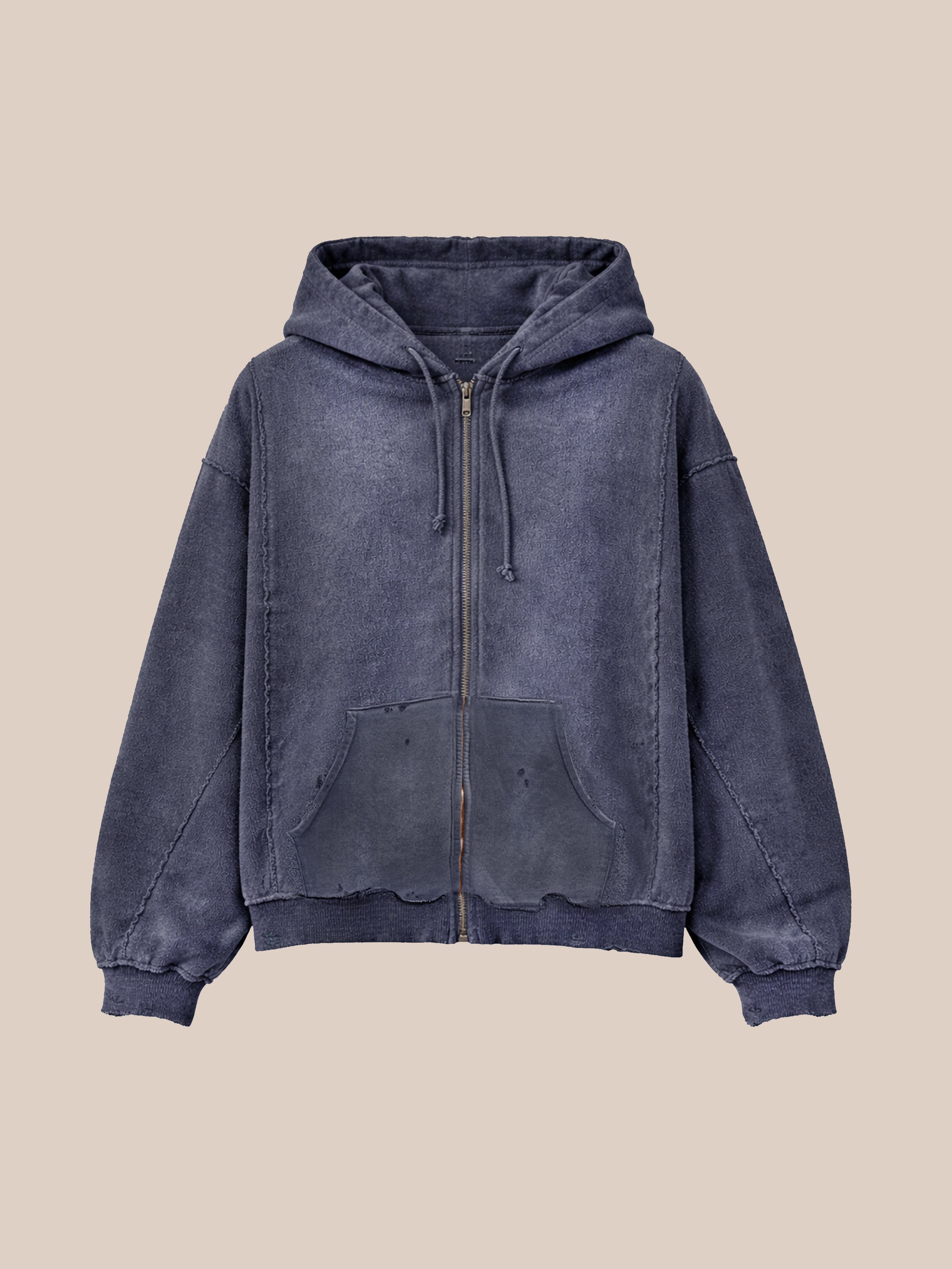 The FOUND Inside Out Zip Up Hoodie is a unisex, relaxed fit hoodie in faded blue, featuring a hood, drawstrings, front pockets, and ribbed cuffs. Displayed on a plain beige background.