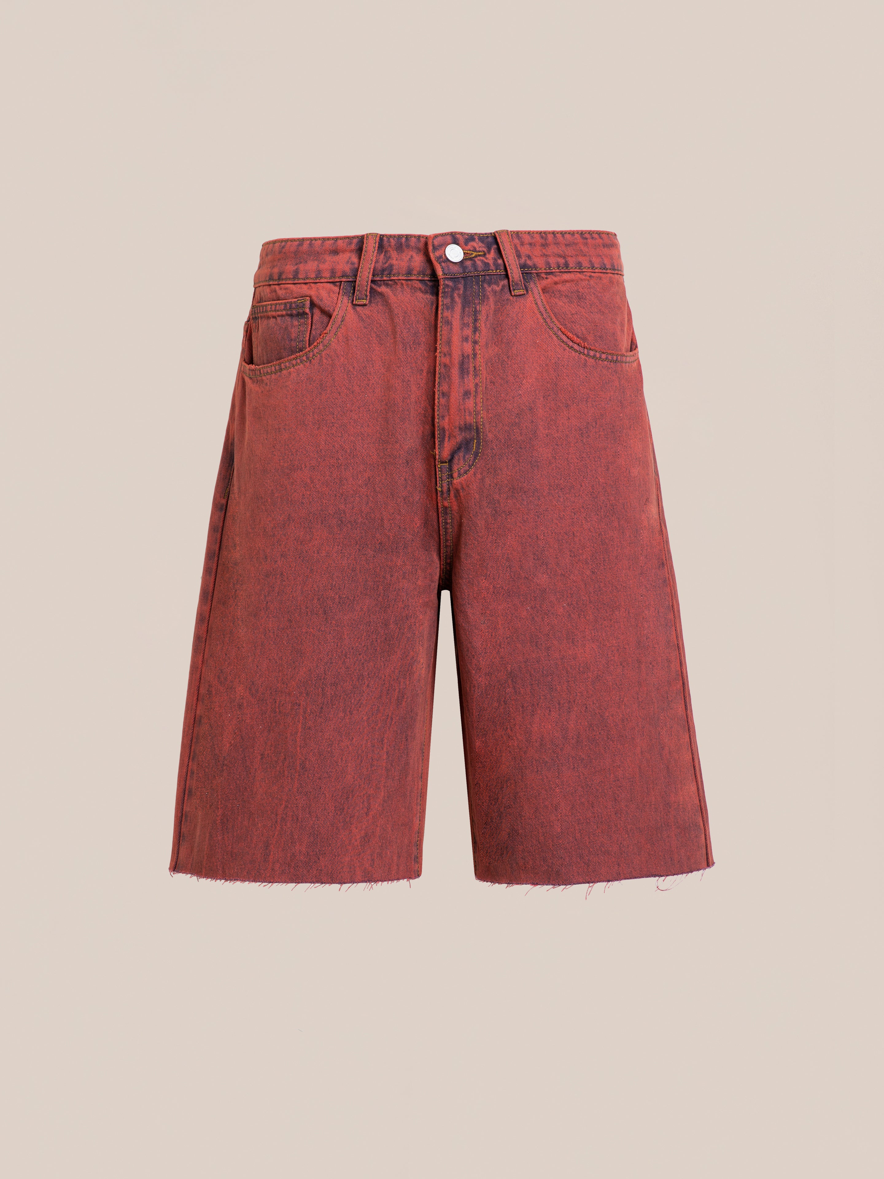 The FOUND Lacy Jean Jorts are vintage red wash shorts made from 100% cotton denim, featuring a raw hem, classic five-pocket style, and button closure, shown on a plain beige background.