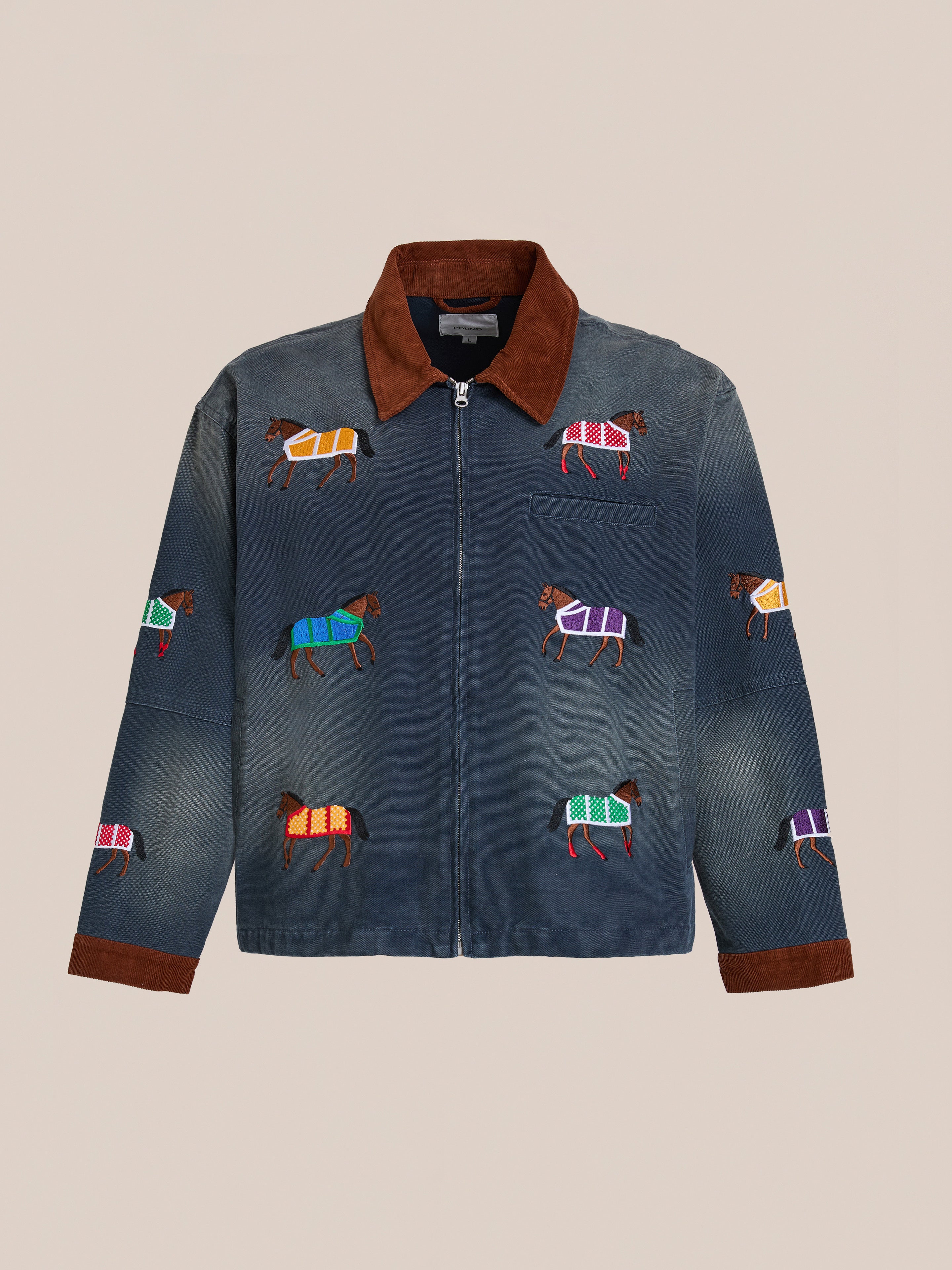 The Found Lariat Horse Embroidered Work Jacket is a unisex navy jacket with brown collar and cuffs, featuring colorful embroidered horses on the front and sleeves.