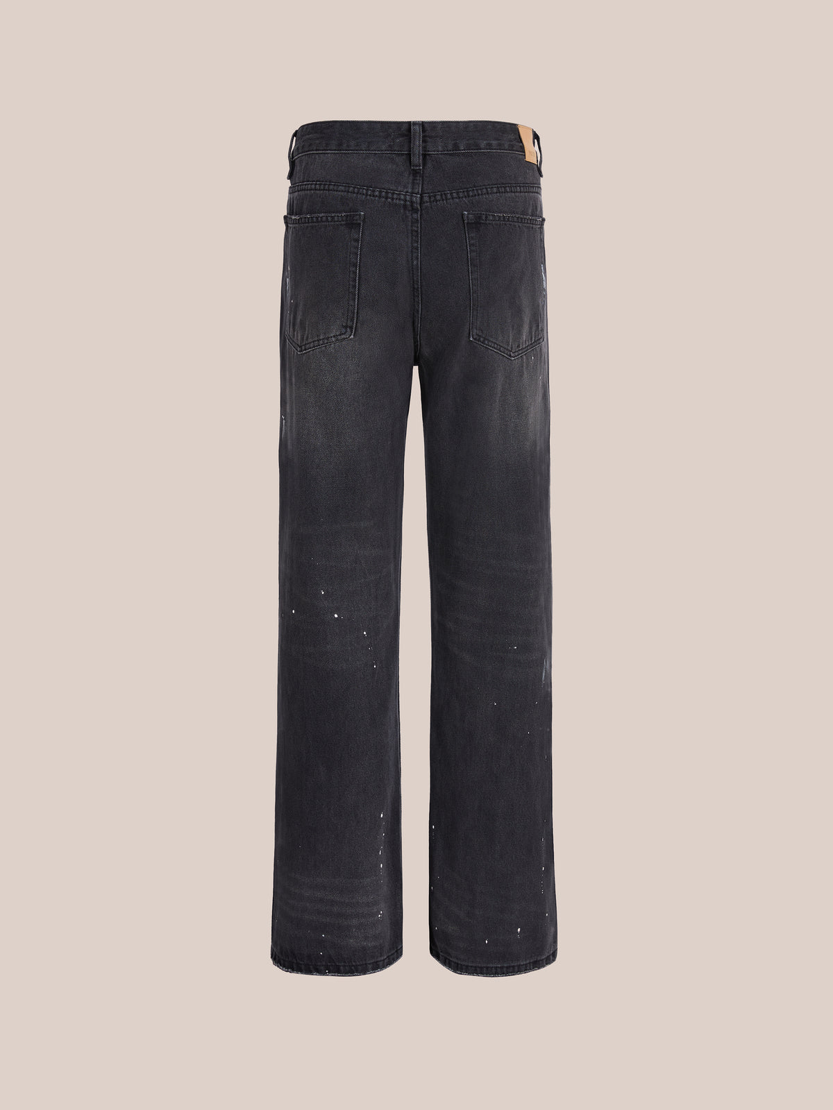 Back view of Monet Paint Jeans by FOUND: vintage black denim, wide legs, visible back pockets, slight fading, and unique paint splatter details.