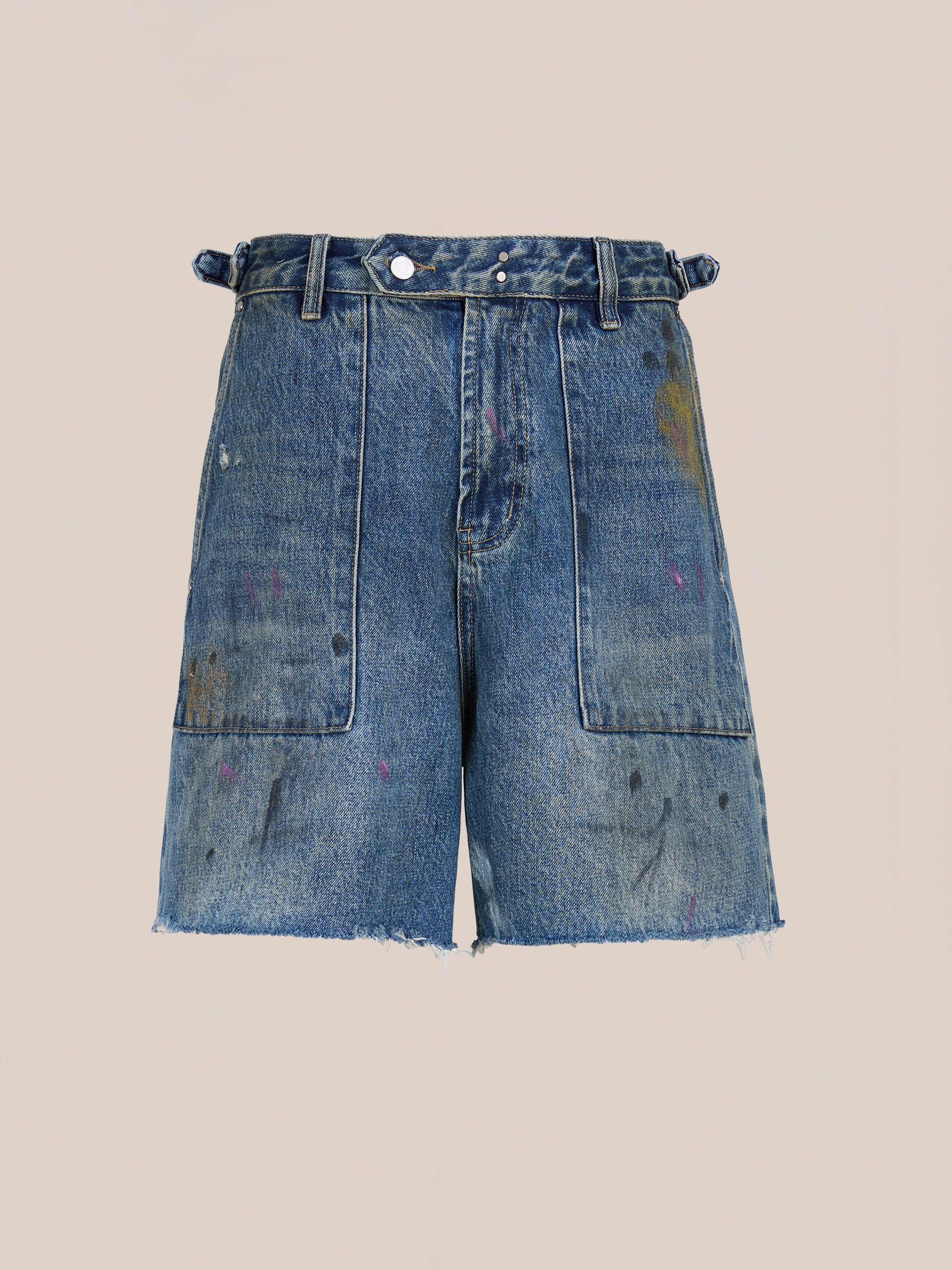 Found’s Paint Studio Denim Shorts feature a vintage blue wash, high waist, large front pockets, belt loops, frayed hems, and visible paint splatter details, shown against a plain background.