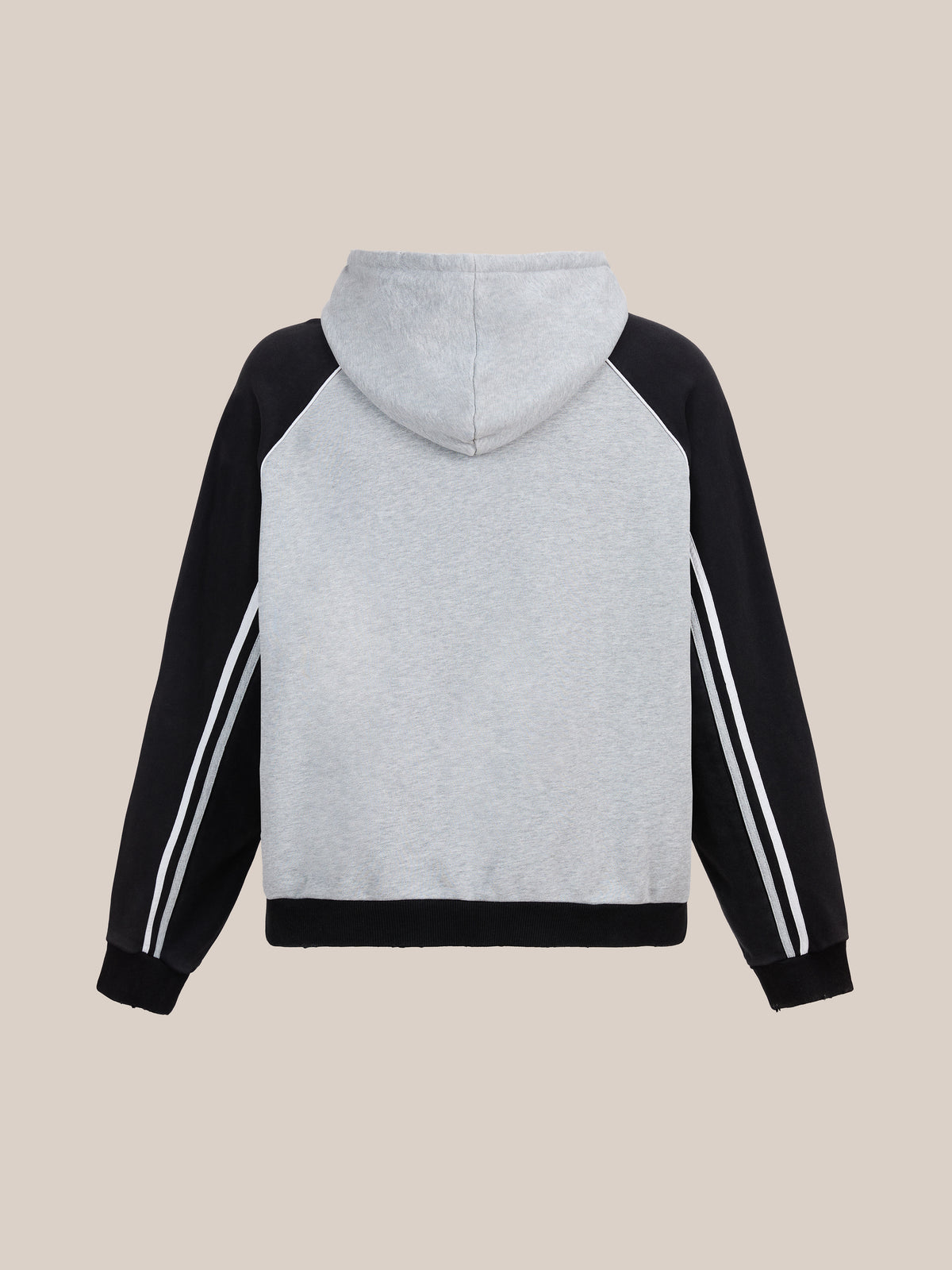 FOUND Racer Hoodie in gray, featuring black raglan sleeves and white arm stripes, shown from the back on a beige background.
