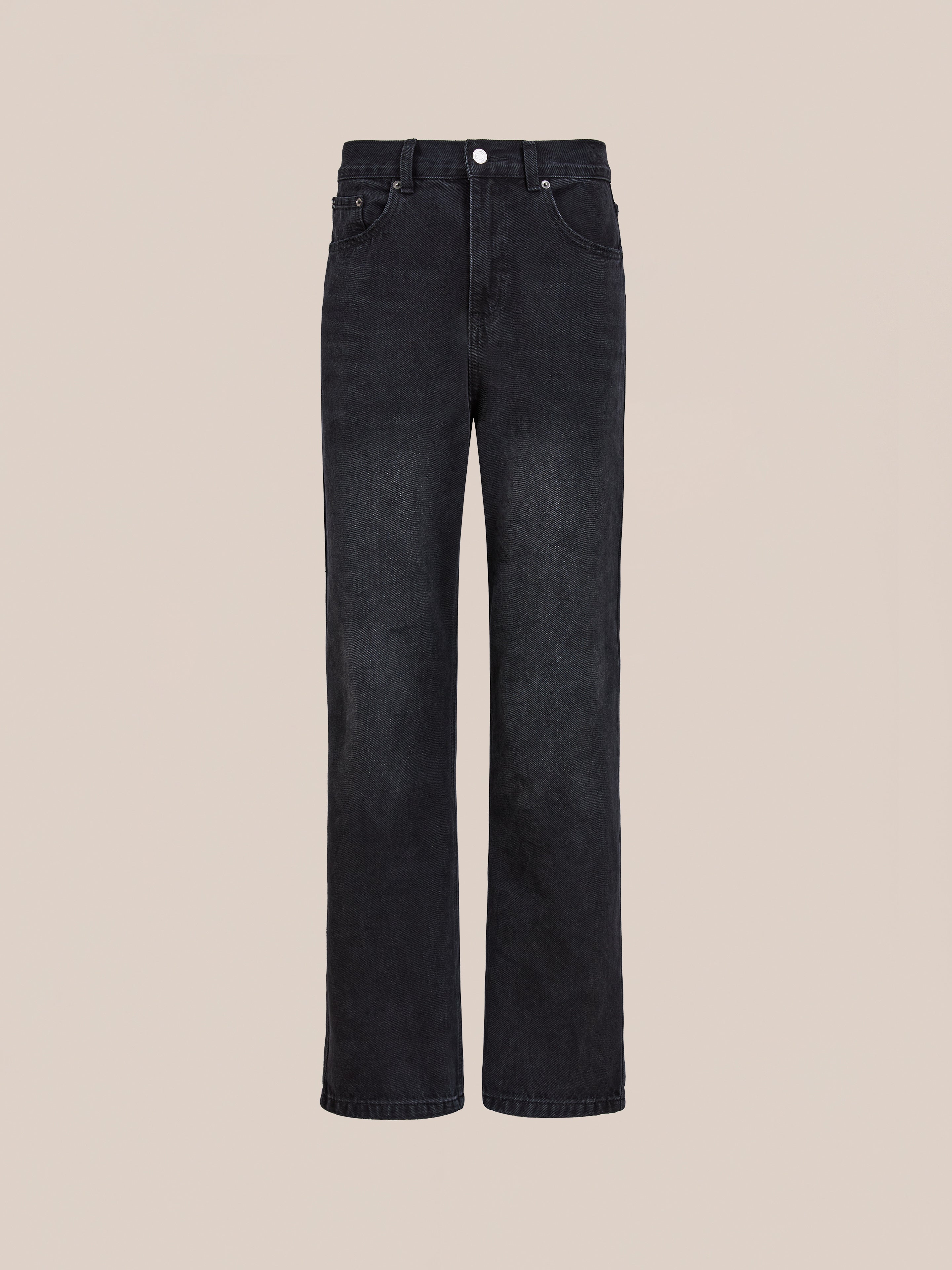 Found’s Straight Leg Jeans, featuring a high-waisted black cotton denim design, are displayed against a light beige background.