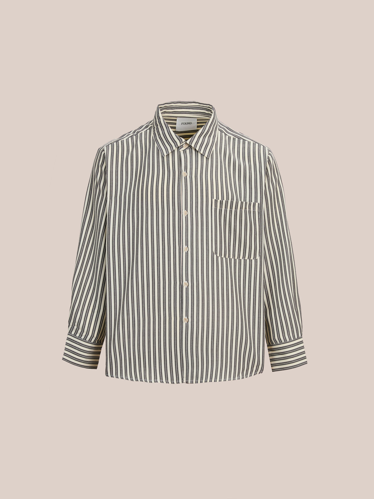 FOUND Stripe Pocket Oxford Shirt: Unisex relaxed fit with vertical black and white stripes, chest pocket, and classic collar, shown on a plain beige background.