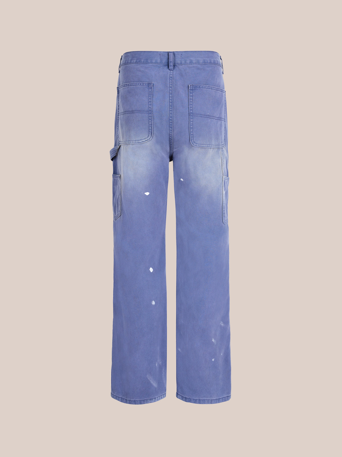 Sunbleached Utility Pants by FOUND: blue pants with white paint splatters, large back pockets, and a relaxed vintage fit, shown on a plain light background.