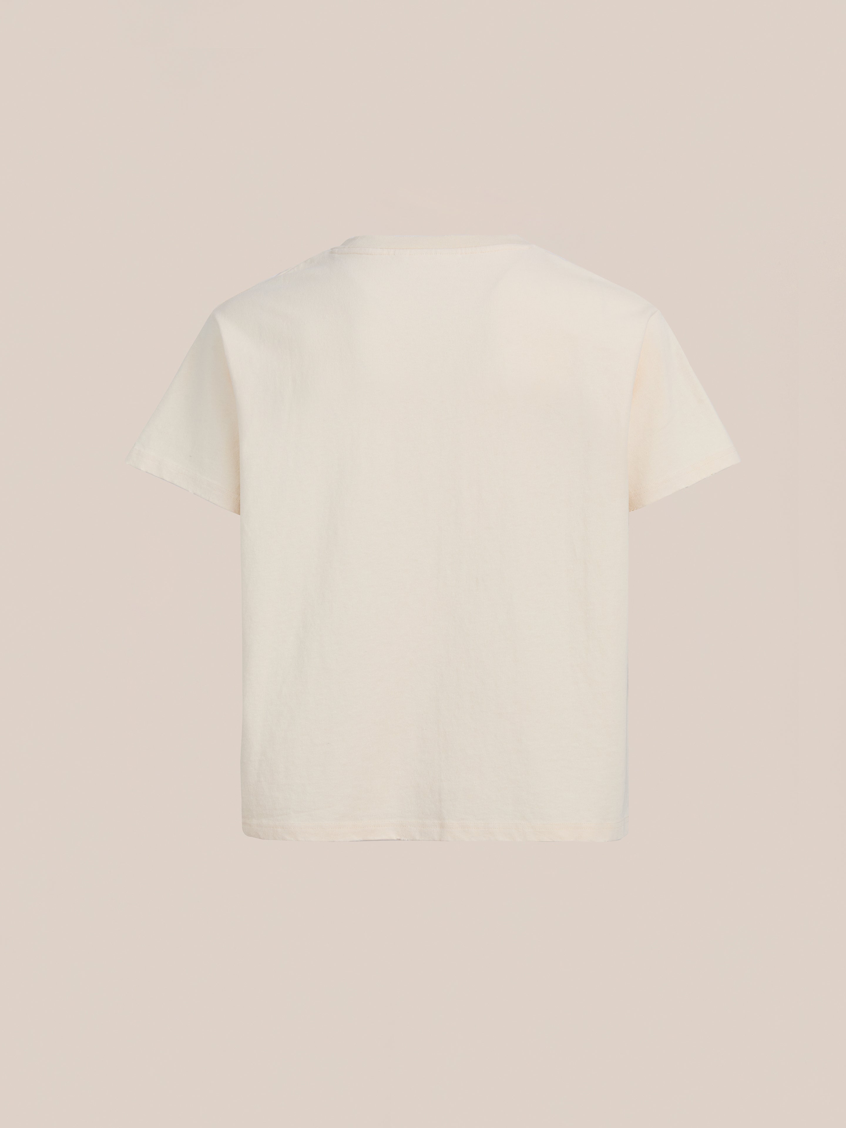 The FOUND Tapestry Logo Paint Tee is shown from the back against a neutral background, featuring a plain white design and crafted from premium cotton for a relaxed fit.