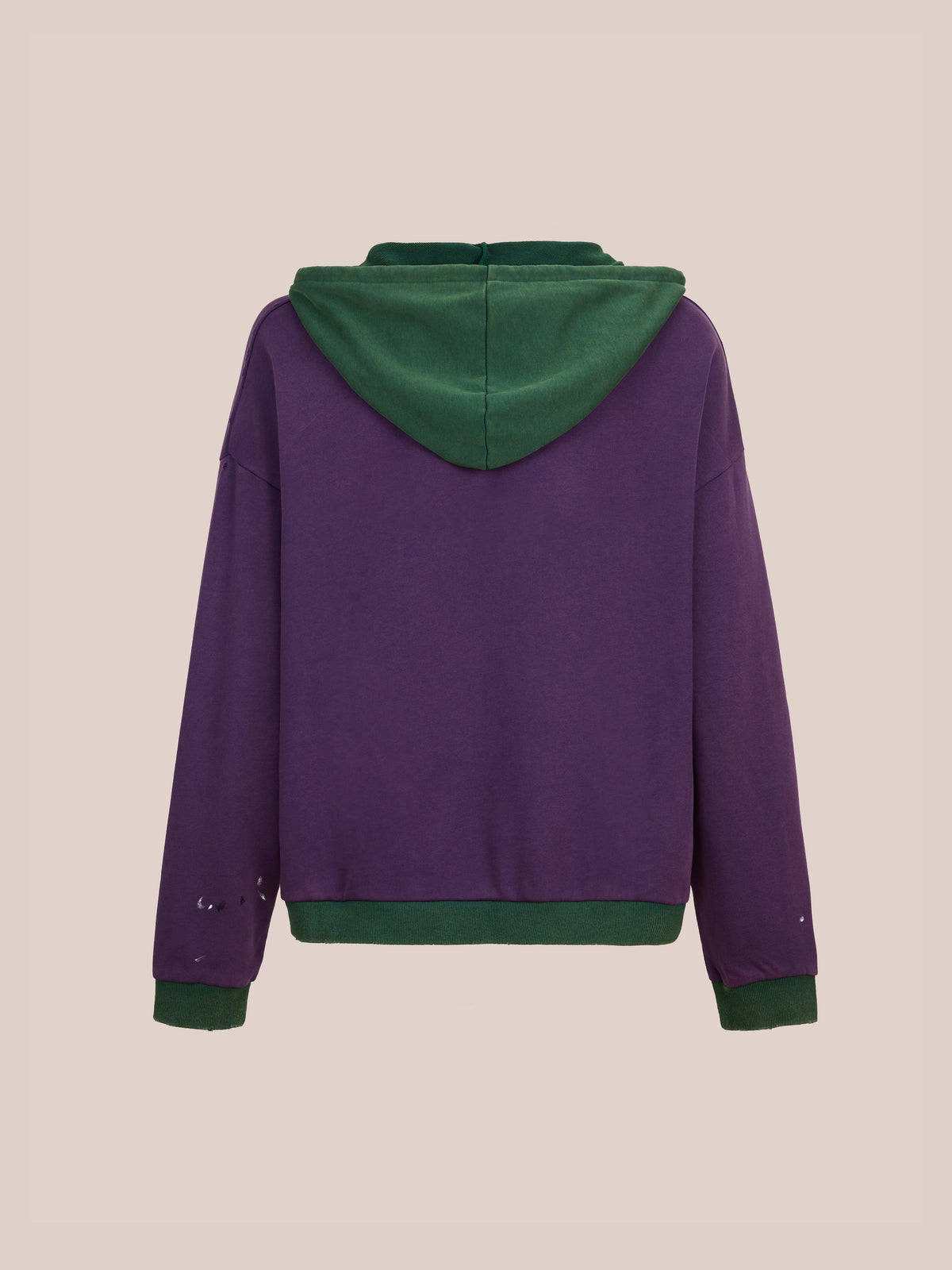 The FOUND Two Tone Painter Hoodie, a unisex relaxed fit in purple with green hood and cuffs, is shown from the back on a beige background.