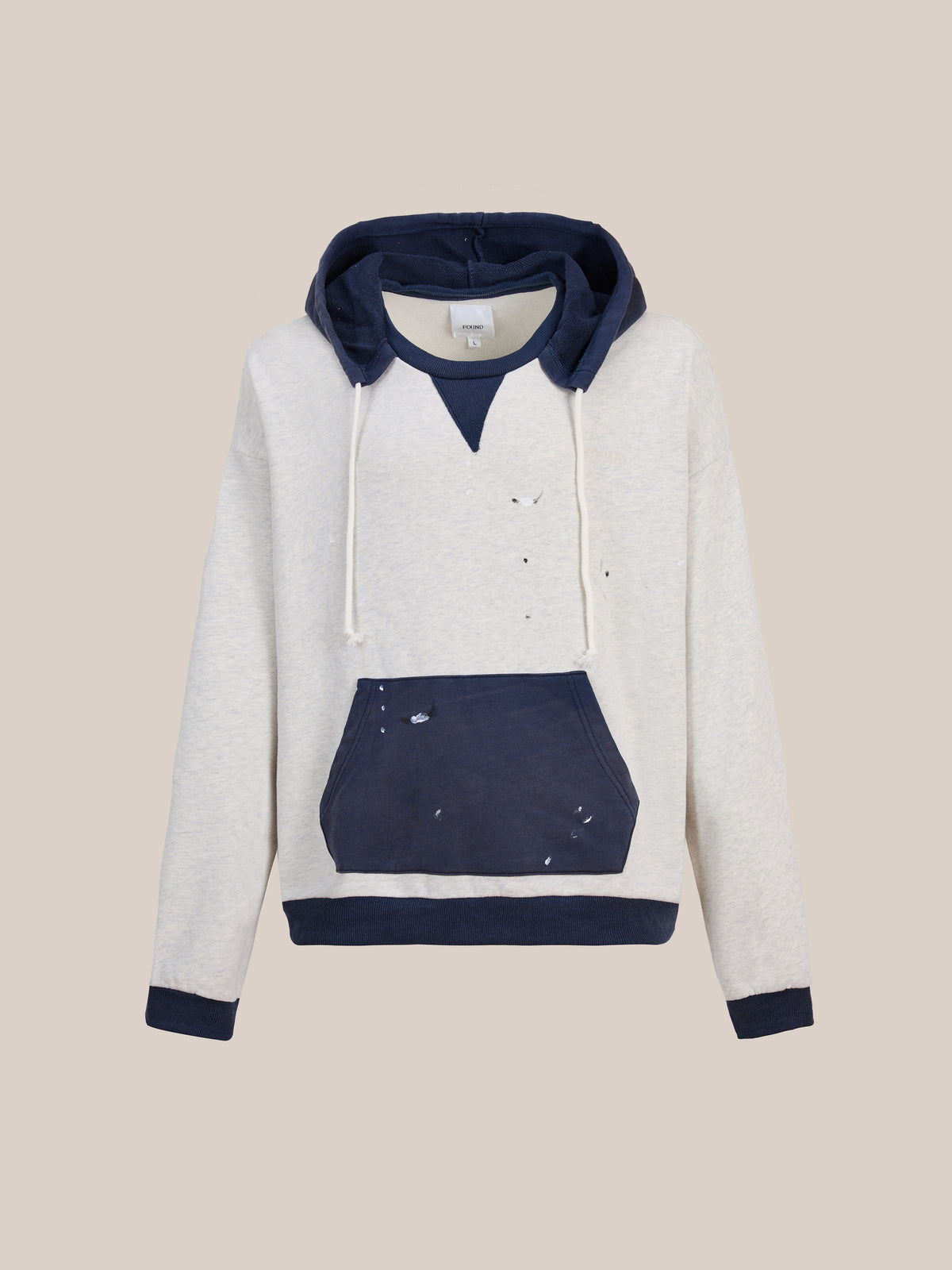 FOUND’s Two-Tone Painter Hoodie features a light grey body contrasted with a navy blue hood, front pocket, cuffs, and hem. White drawstrings and subtle distressed marks give this hoodie a vintage-inspired vibe.