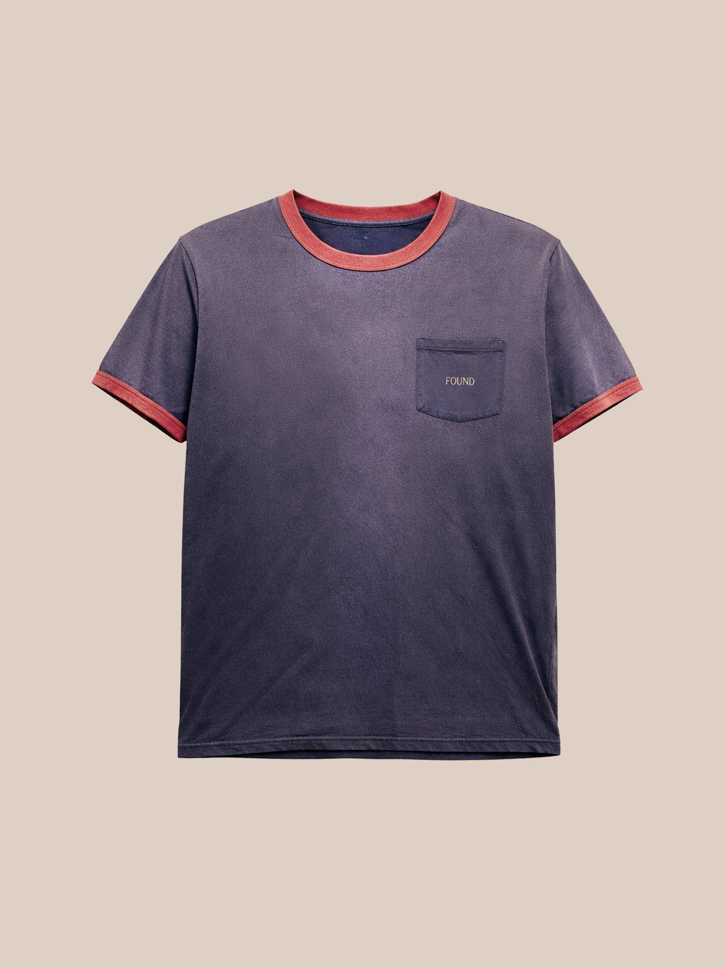 The FOUND Washed Ringer Logo Tee is a navy short-sleeve vintage athletic shirt with a relaxed fit, red collar and cuffs, and a chest pocket featuring an embroidered "FOUND" logo.