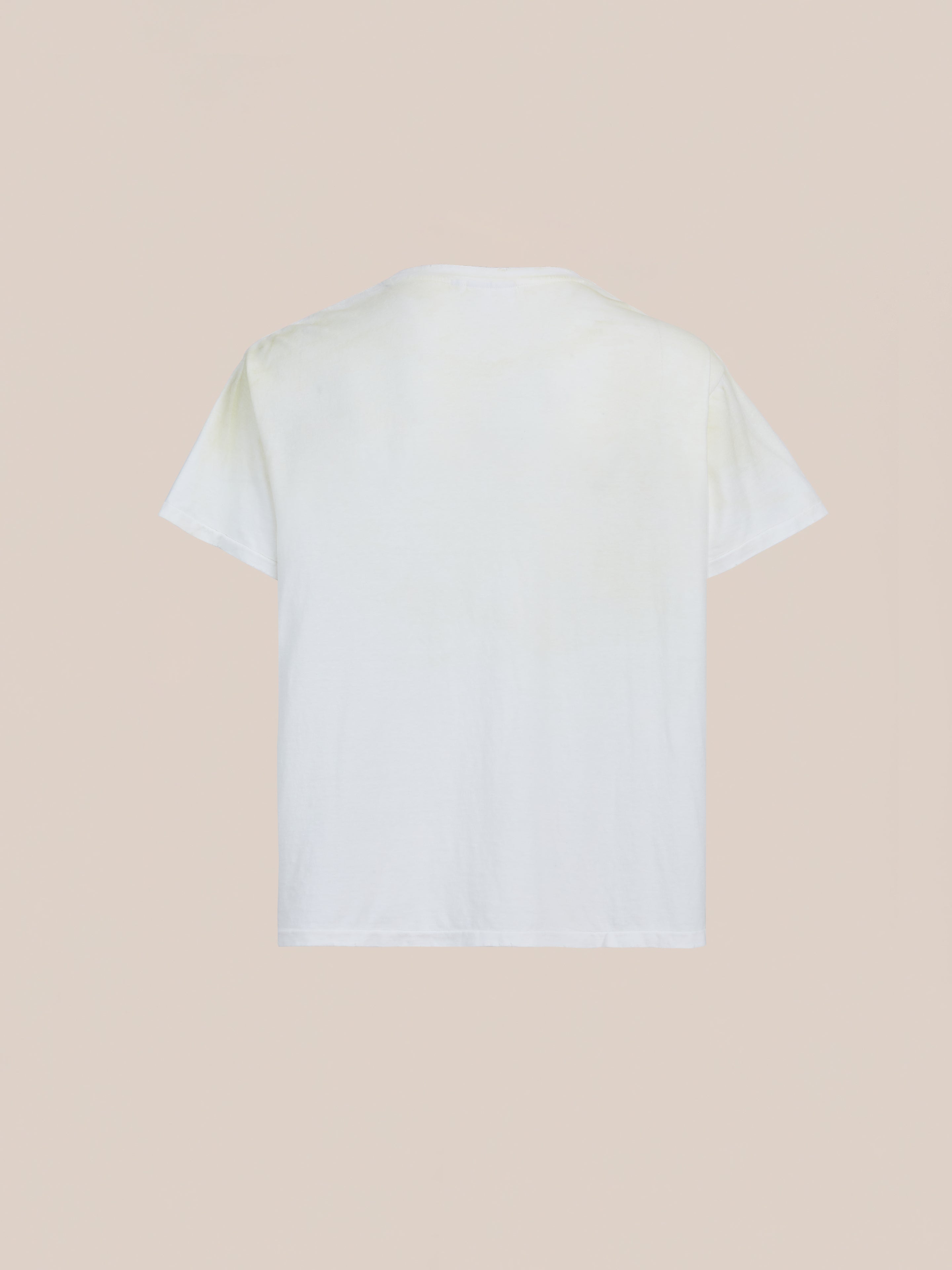 The FOUND Weathered Pocket Tee, a relaxed-fit vintage white shirt, is displayed from the back against a neutral beige background.