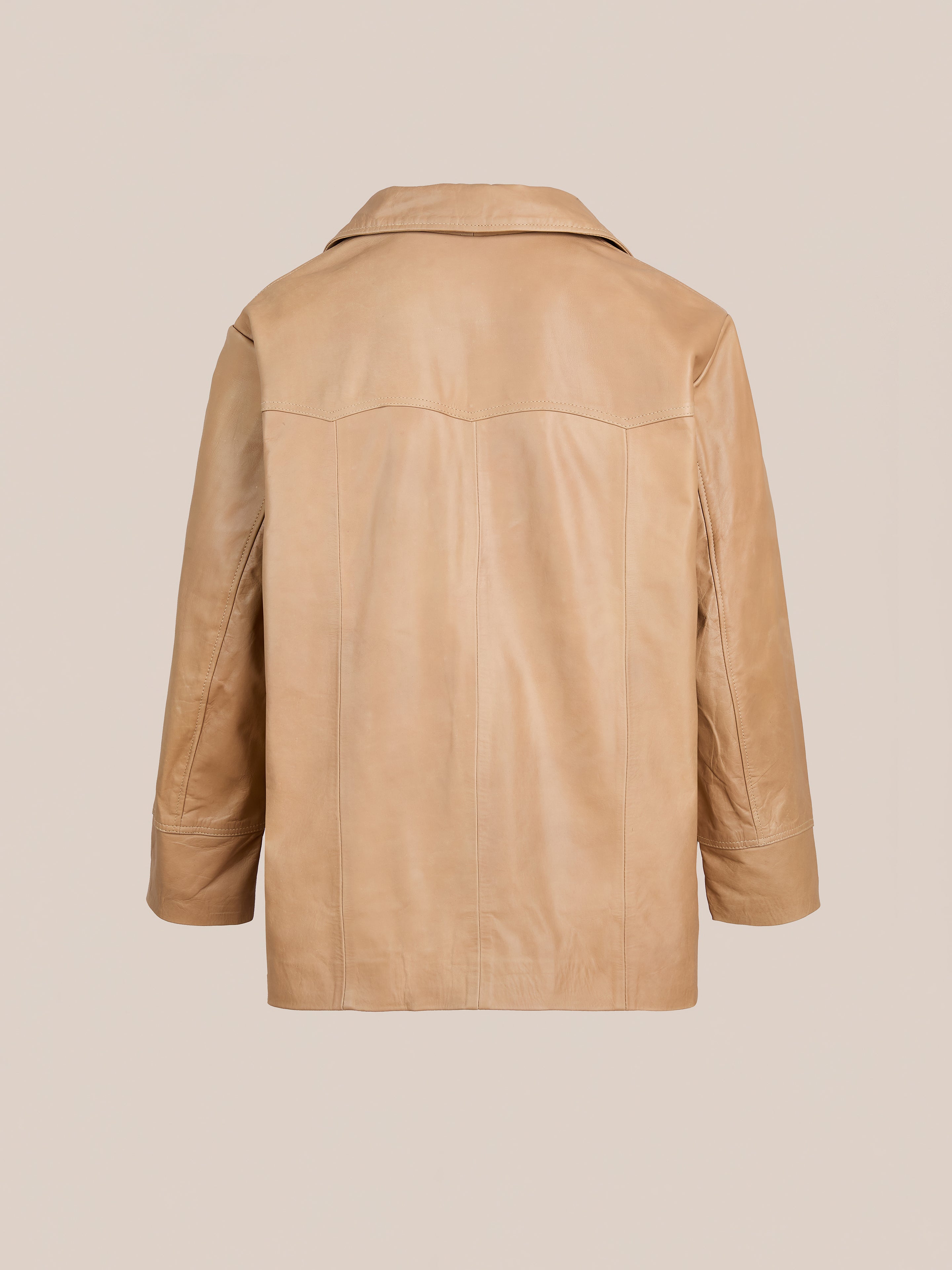 FOUND Western Oversized Leather Blazer in tan leather, shown from the back with visible seam detailing, straight hem, long sleeves, and an oversized fit on a plain background.