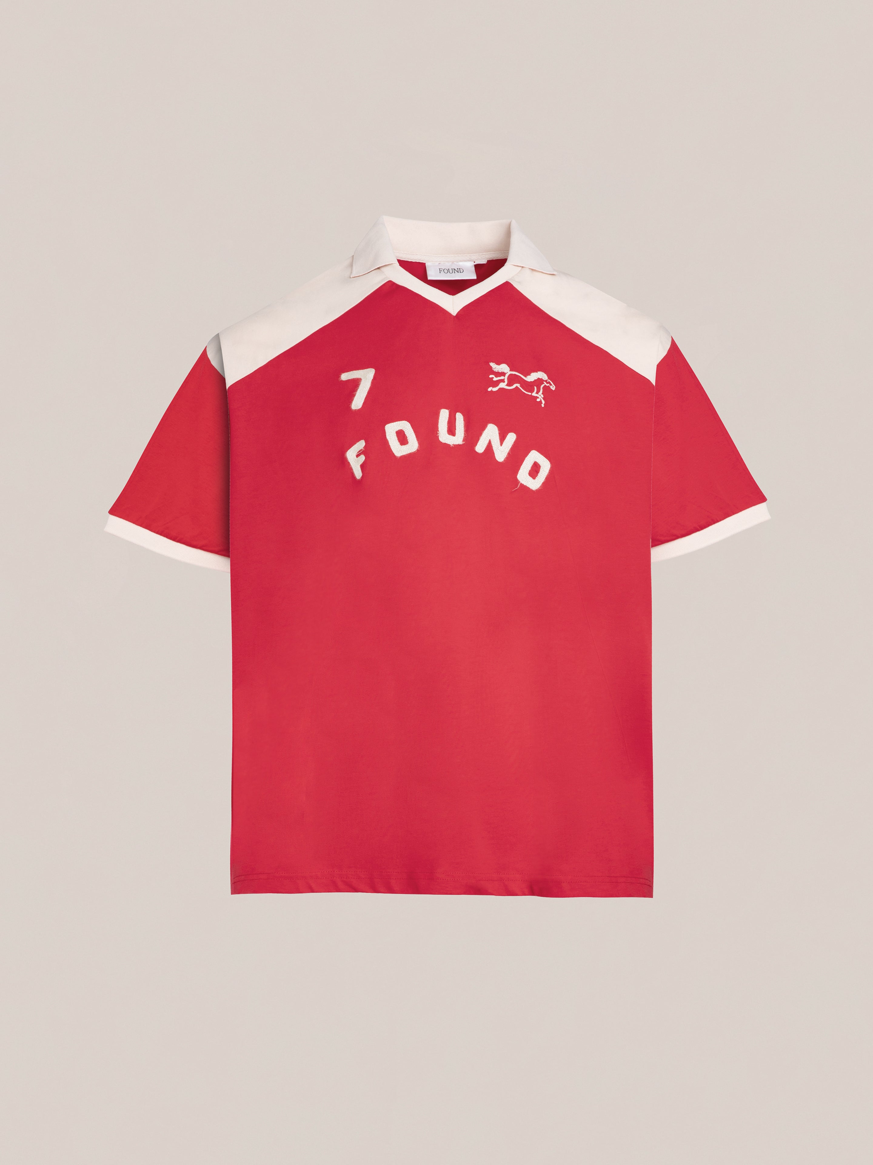 Introducing the Goji Red Jersey by FOUND, showcasing white contrast color yoke and collar, featuring the number 7. This stylish piece includes a small horse graphic and the brand name "FOUND" in vintage athletic uniform style on the front.