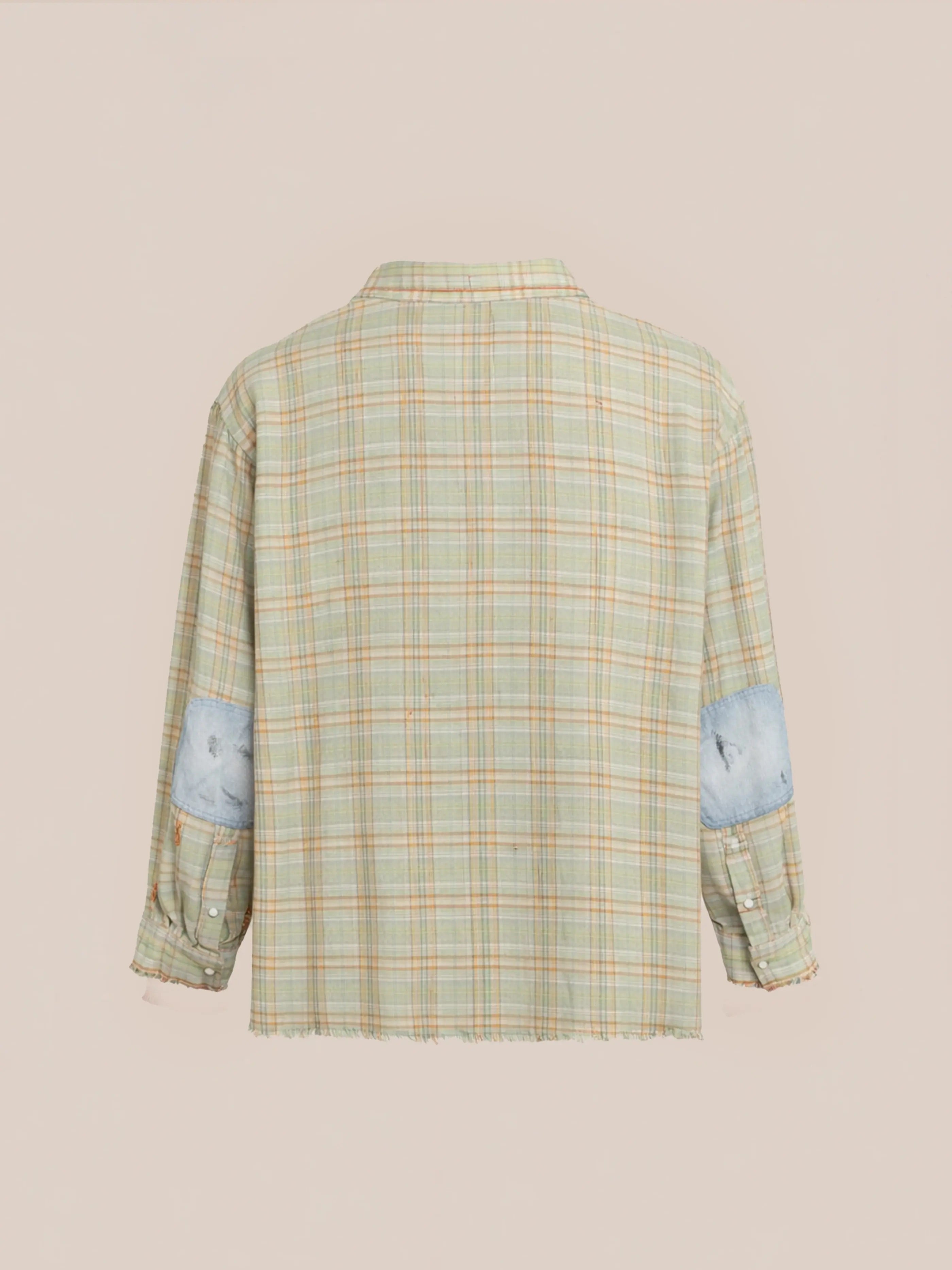 The FOUND Plaid Denim Shirt is a unisex, relaxed-fit workwear style with long sleeves, denim elbow patches, and pastel plaid pattern, shown from the back on a beige background.