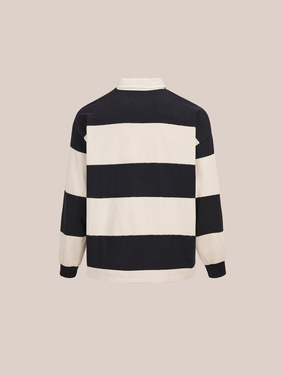 The FOUND Bird Logo Rugby—a unisex, relaxed-fit long-sleeve top with wide black and off-white stripes—is shown from the back on a beige background.