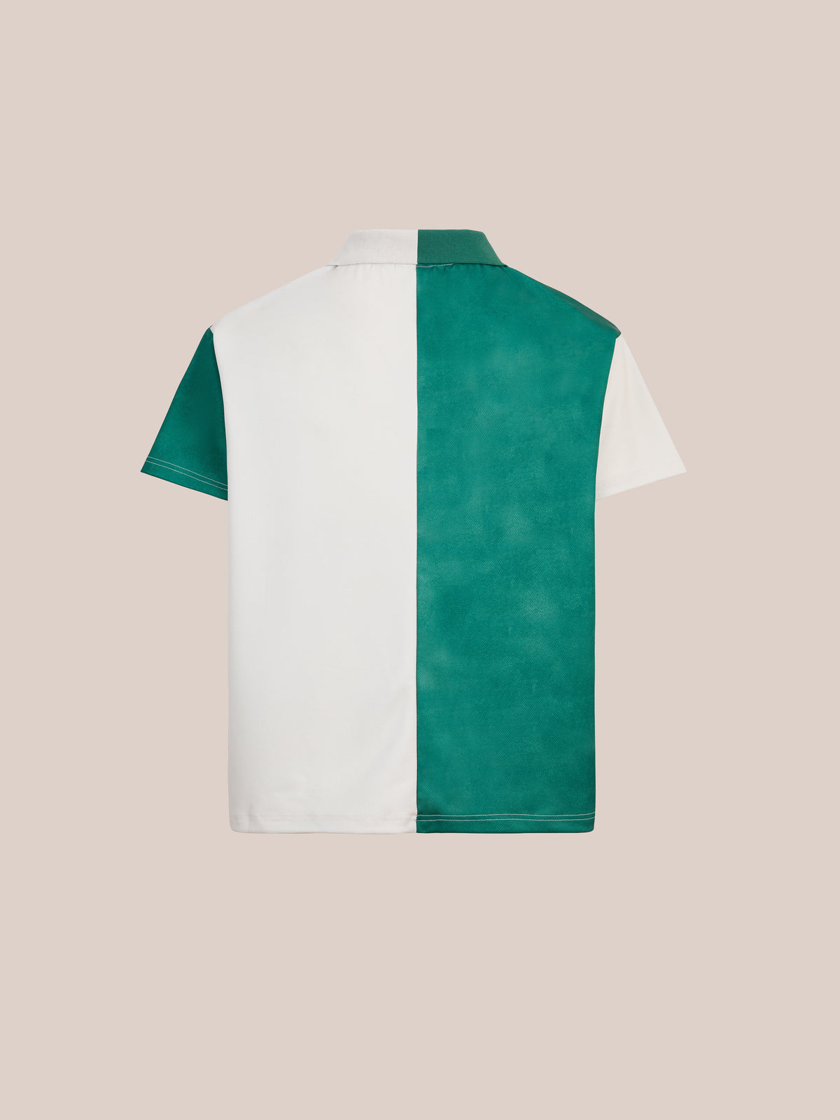 The FOUND Color Block Regent Jersey features a bold, collegiate design with short sleeves and a distinctive color block pattern—crisp white on the left half and bold teal on the right. Displayed from the back against a plain beige background, this polo channels classic vintage sportswear style.
