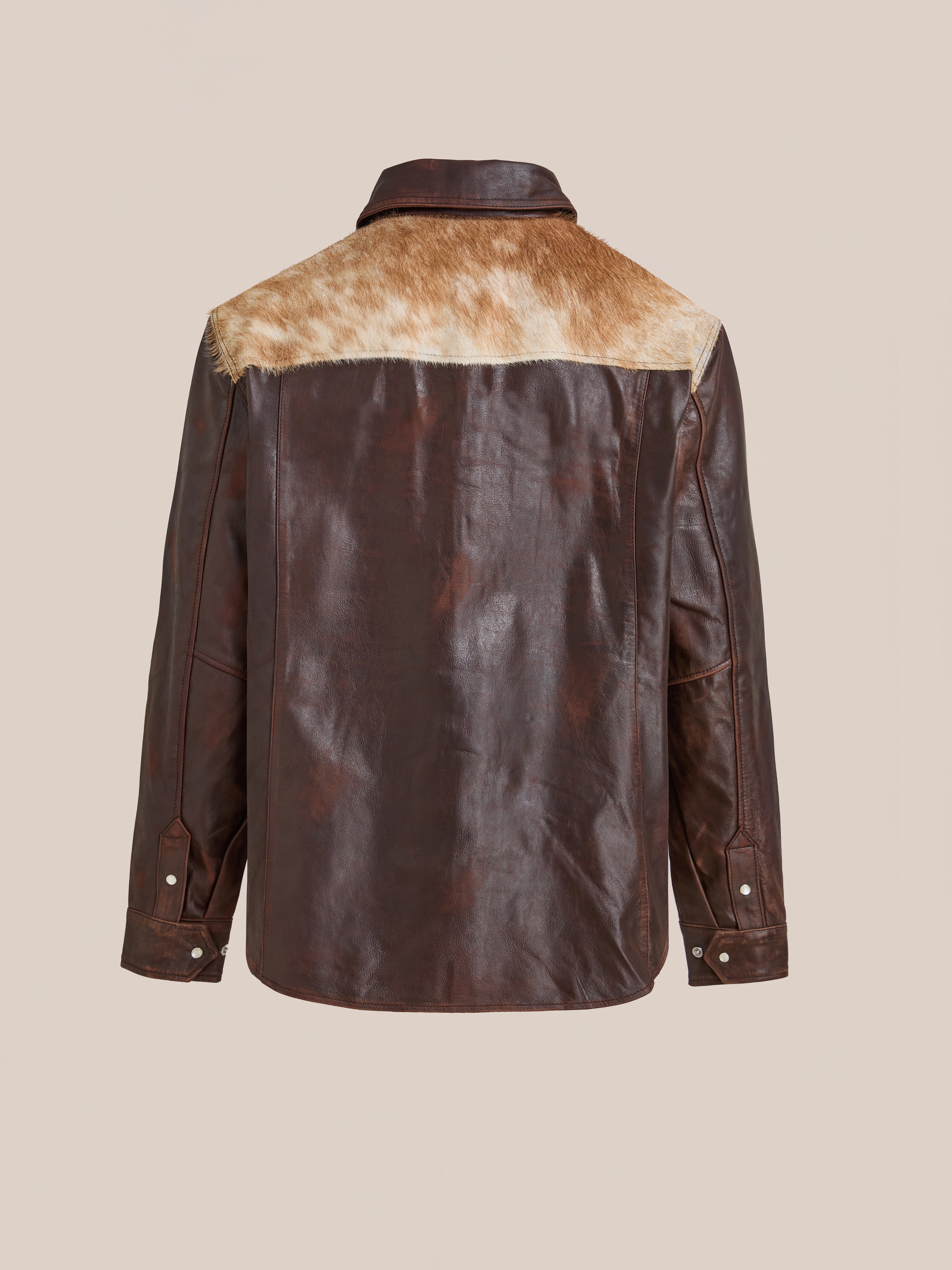 Back view of the FOUND Distressed Leather Cowhide Contrast Western Shirt in brown, featuring a light brown fur shoulder panel, buttoned cuffs, and a straight hem.