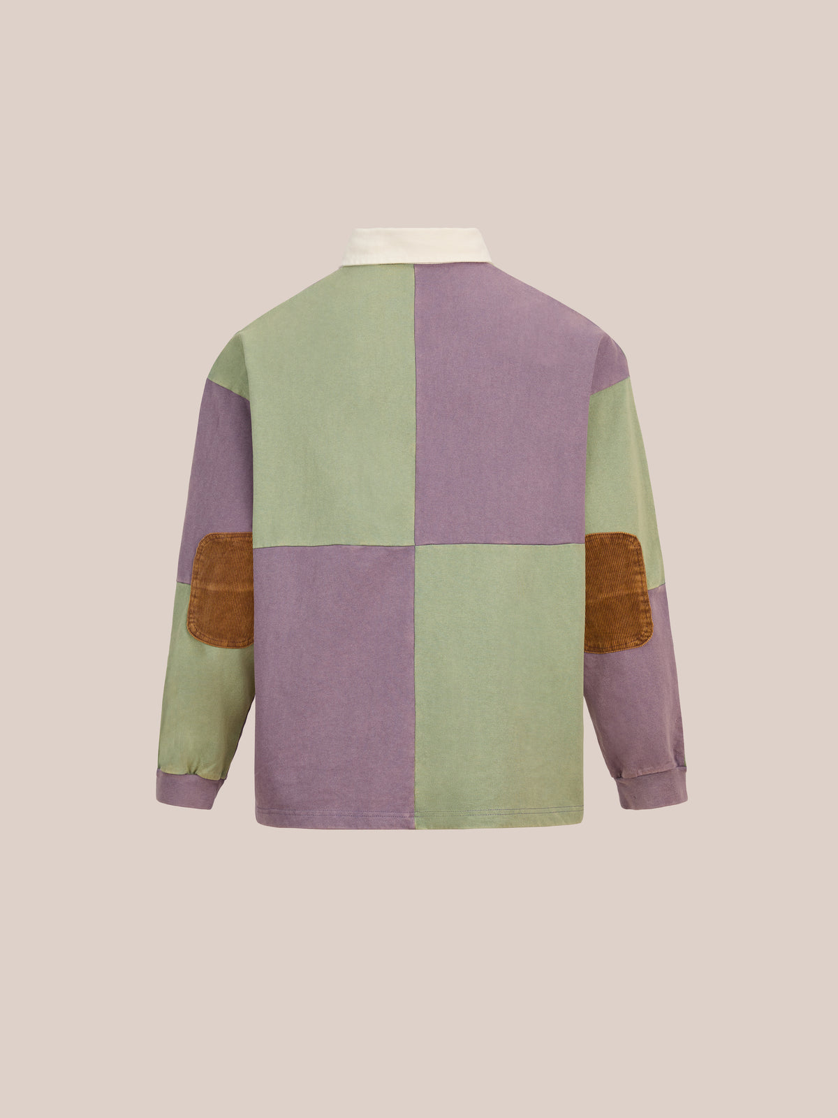 Back view of the FOUND Crestfield Rugby—a unisex relaxed-fit long-sleeve shirt featuring bold green and purple color blocks, brown suede elbow patches, and a crisp white collar, effortlessly combining classic athletic rugby style with vintage sportswear, set against a neutral background.
