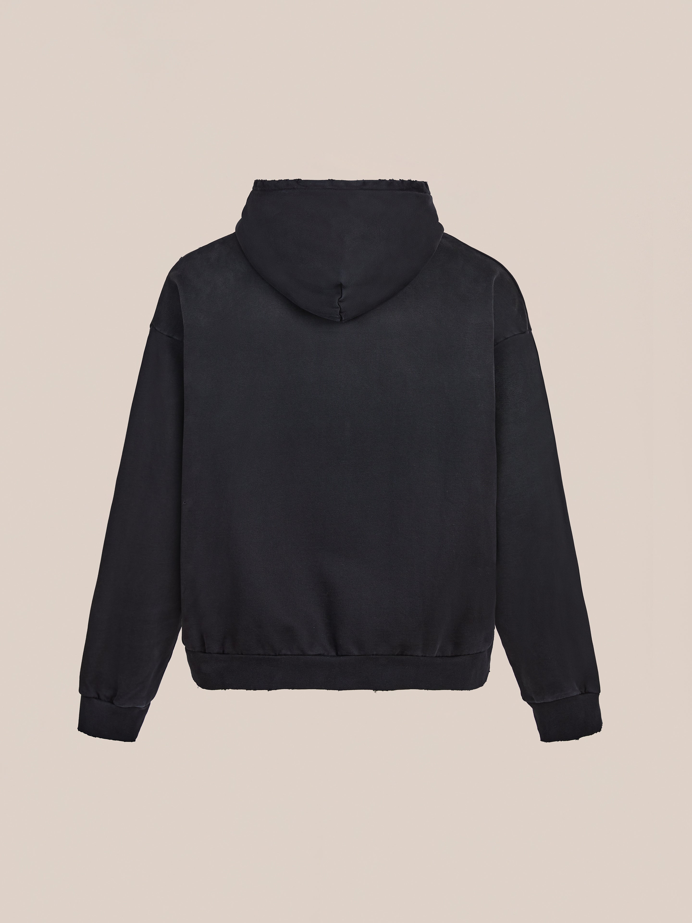 The FOUND Distressed Pullover Hoodie is shown laid flat on a beige background, hood up and sleeves outstretched, highlighting its classic unisex relaxed fit.