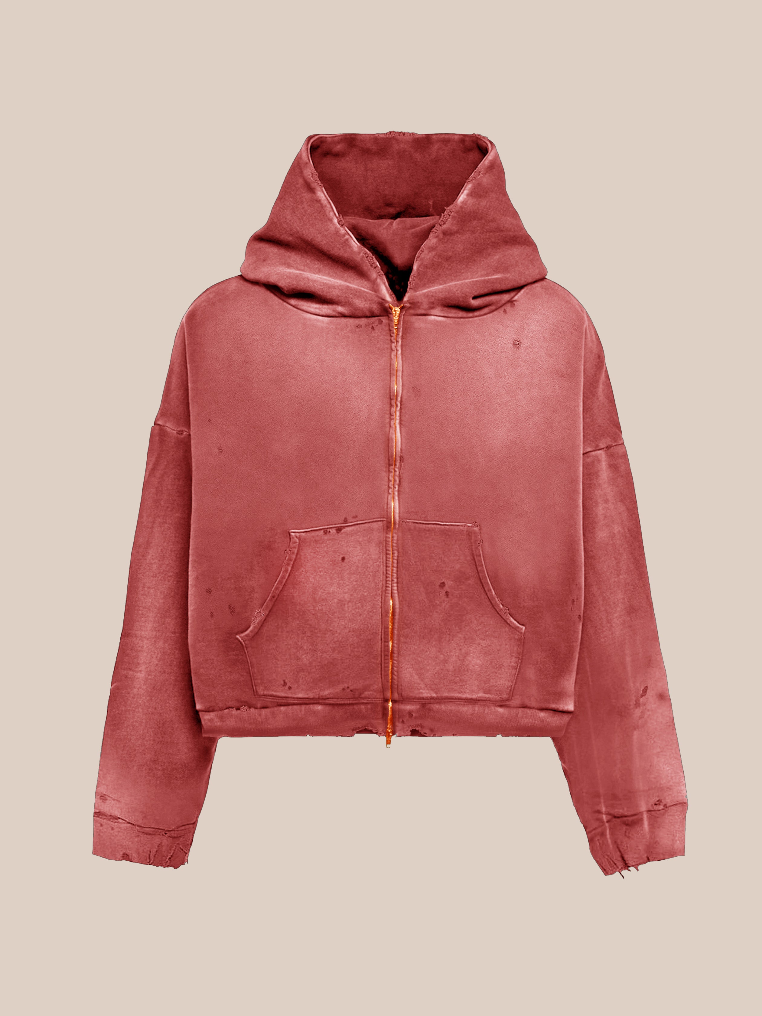 FOUND’s Distressed Thermal Lined Zip Up Hoodie features a dusty pink unisex relaxed fit, front pocket, and hood, shown as a zip-up sweatshirt against a beige background.