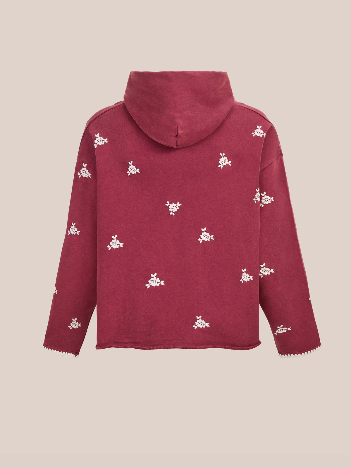 The FOUND Embroidered Motif Hoodie is a maroon unisex relaxed fit hoodie with white floral embroidery on the back and sleeves, shown on a neutral backdrop.