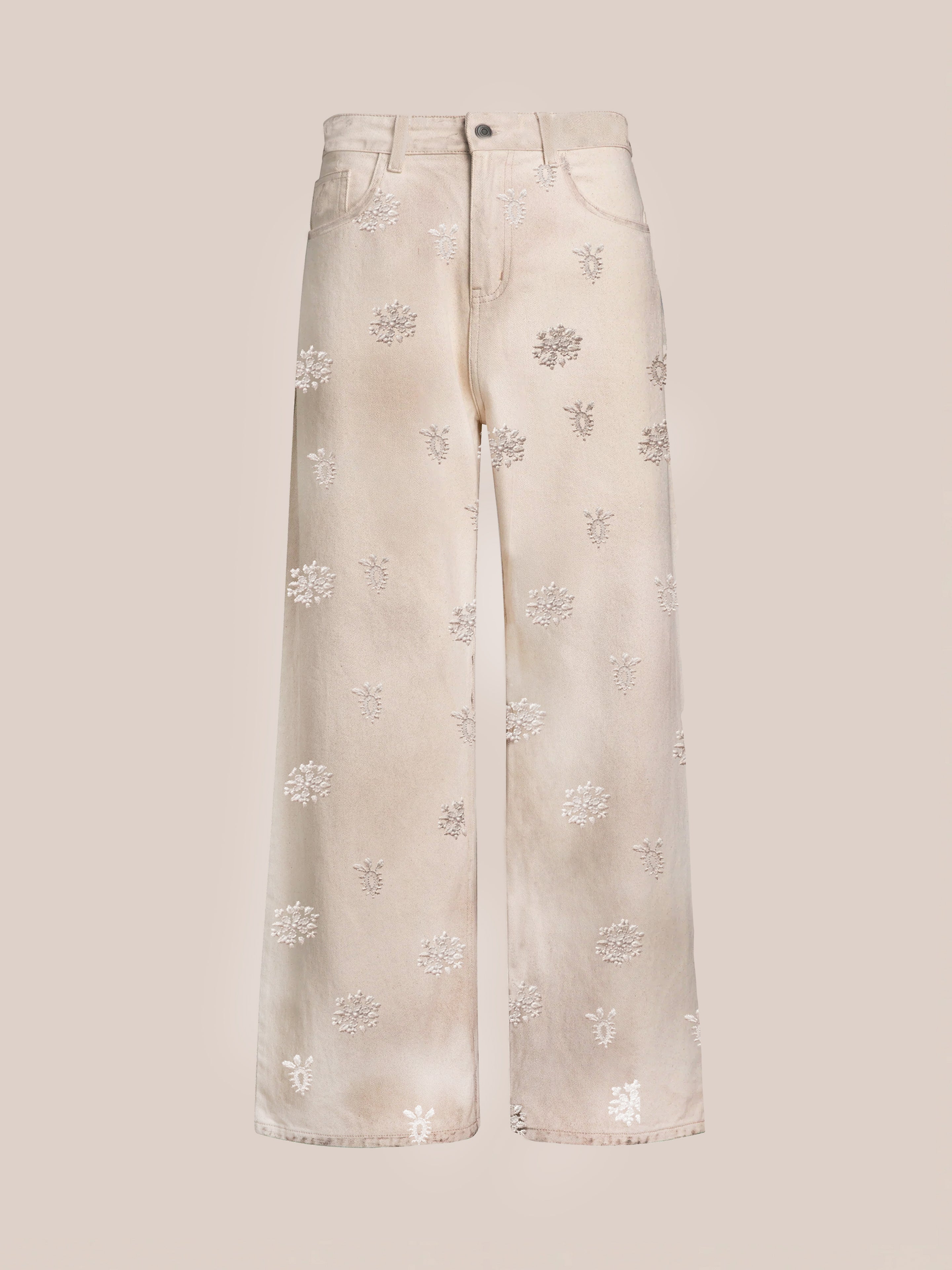 FOUND’s Embroidered Motif Jeans feature a relaxed wide-leg, high-waist design in cream with subtle floral embroidery throughout.