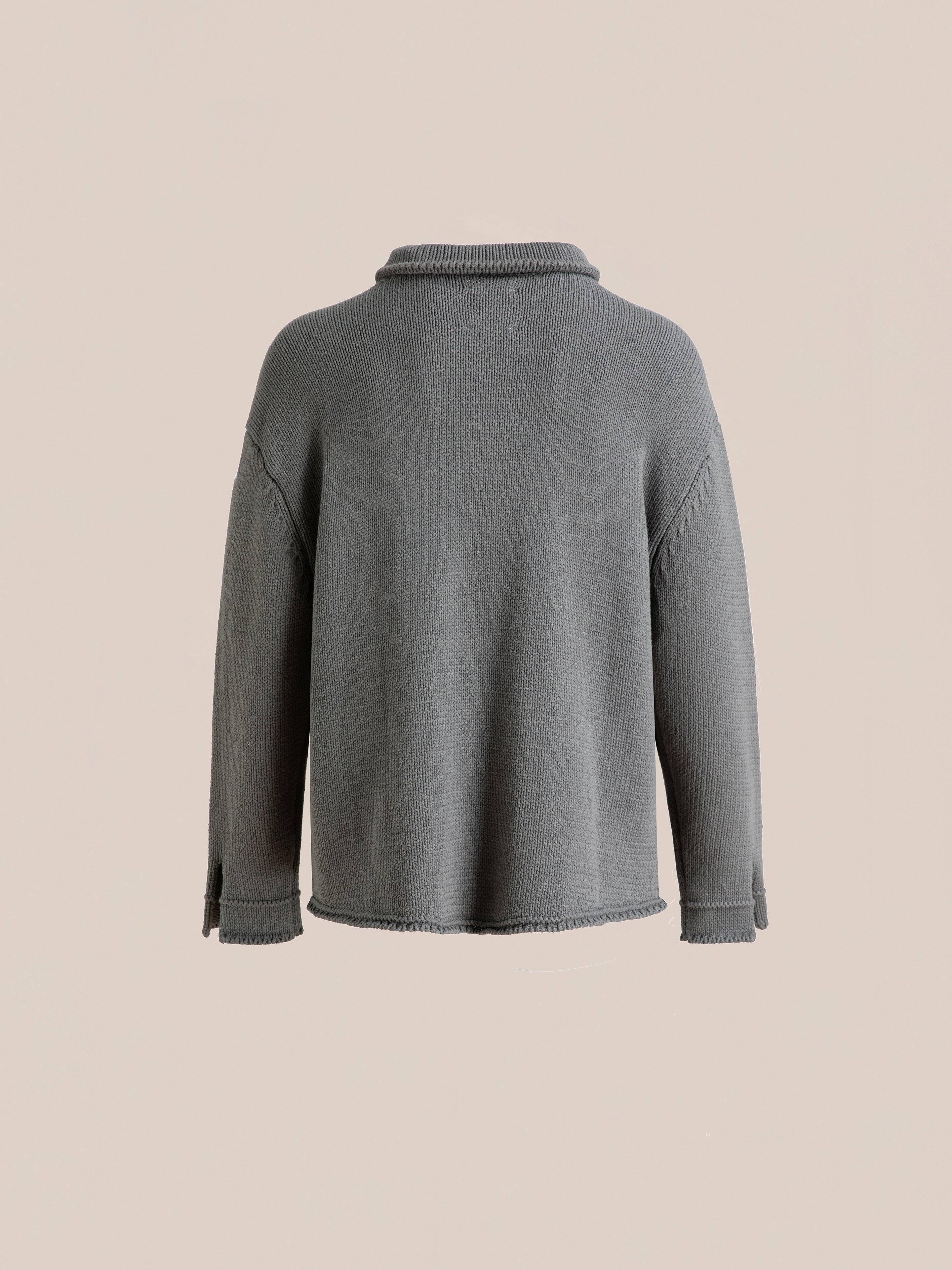 Back view of the Hunter Knit Collared Cardigan by FOUND in gray against a plain beige background. This cardigan is enhanced with subtle seam details on the sleeves and sides, complemented by a cozy collar.