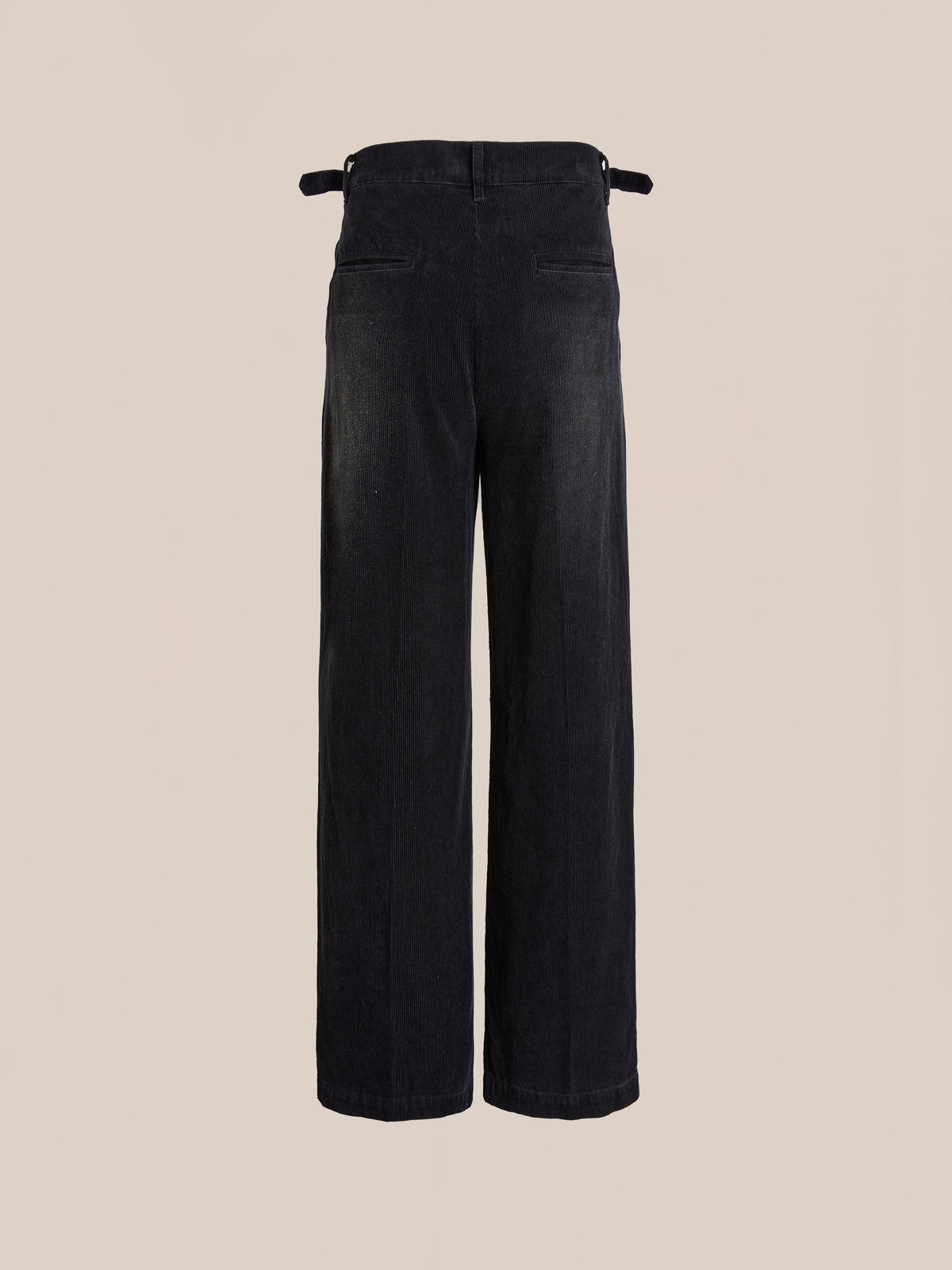 FOUND Faded Pleated Corduroy Pants feature a high waist, wide legs, double pleats, two back pockets, and adjustable side tabs, shown on a plain beige background.