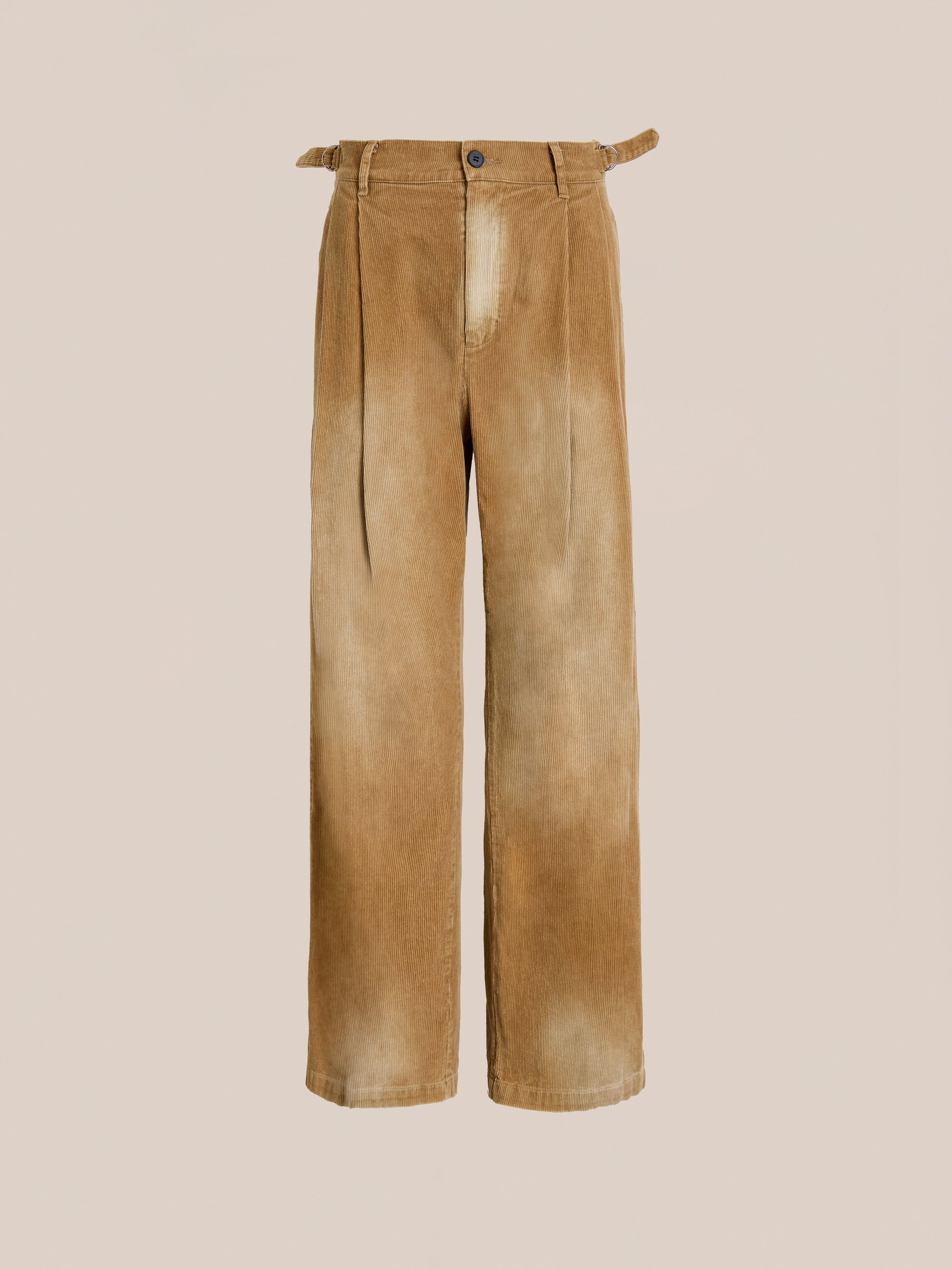 The FOUND Faded Pleated Corduroy Pants feature double pleats, wide legs, a relaxed fit, and a washed tan finish, shown against a plain light background.