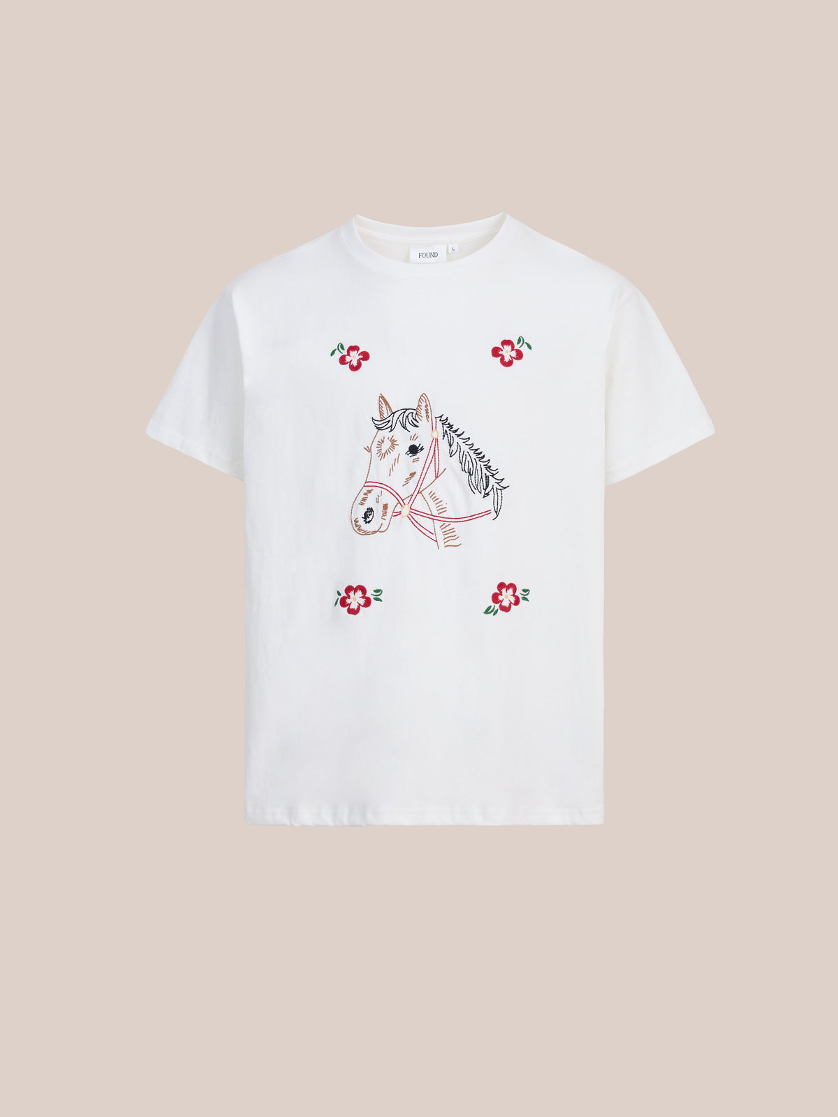 FOUND Floral Horse Tee features a hand-drawn horse with red flowers, vintage folk-inspired. Unisex relaxed fit, shown on a plain beige background.