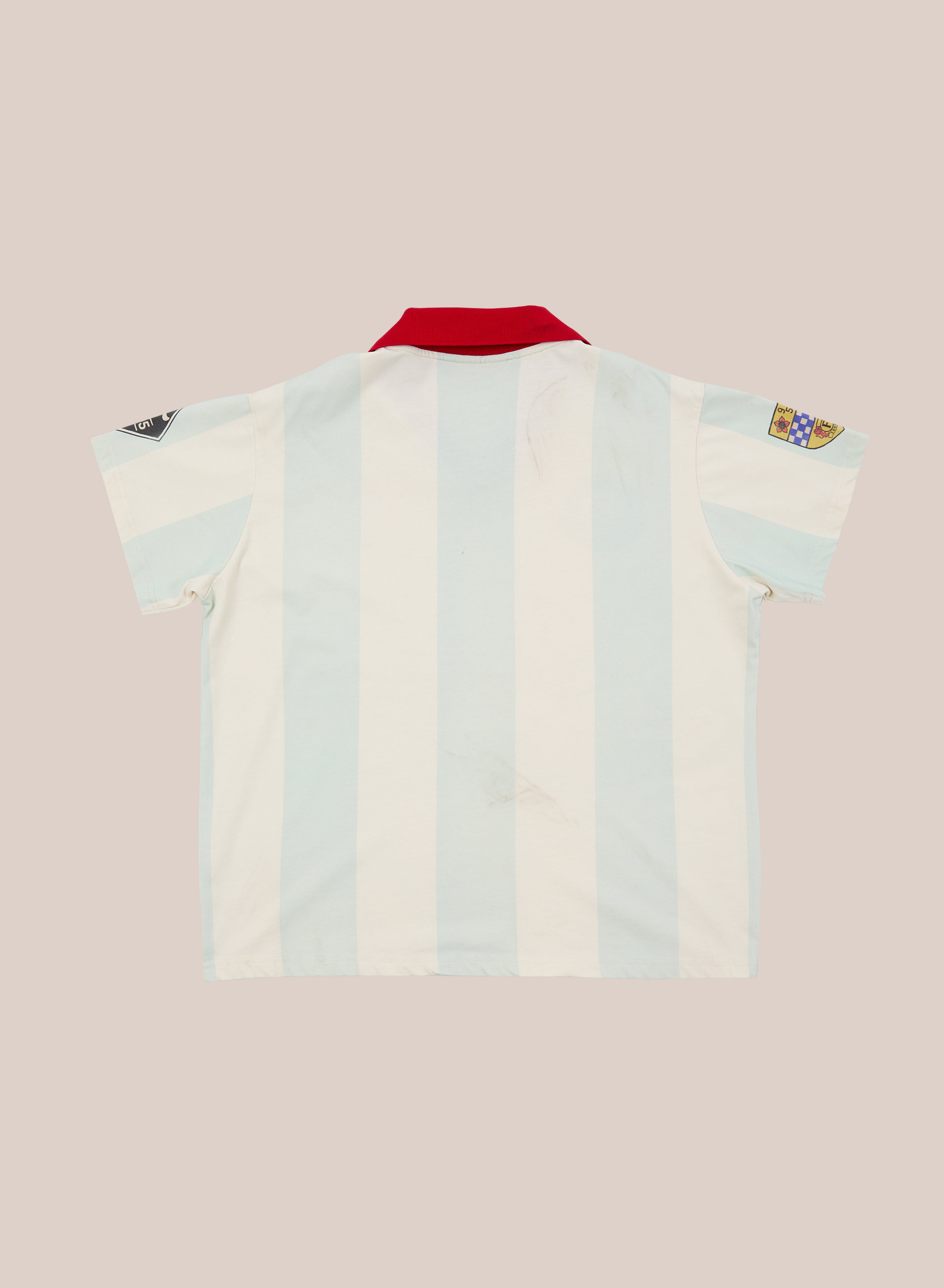 Introducing the FOUND Found Club Short Sleeve Jersey: a short-sleeved jersey featuring light blue and white stripes, a striking red collar, and two sleeve patches, displayed flat on a neutral background.