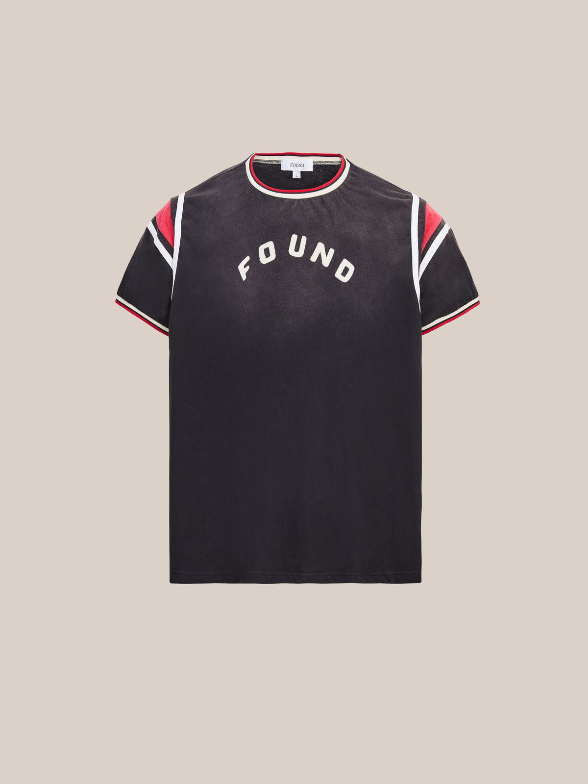FOUND Foundation Practice Jersey – A black short-sleeve t-shirt with “FOUND” printed on the chest, featuring bold red, white, and black stripes on the sleeves and collar for a retro sportswear vibe and unisex practice jersey comfort.