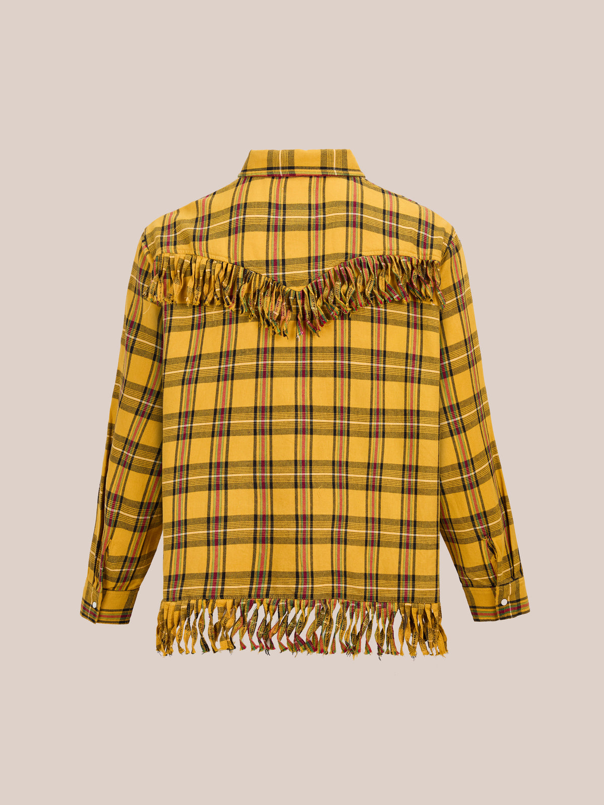 The High Plains Fringe Shirt by FOUND features yellow plaid, long sleeves, buttoned cuffs, and fringe on the back yoke and hem, shown against a beige background.