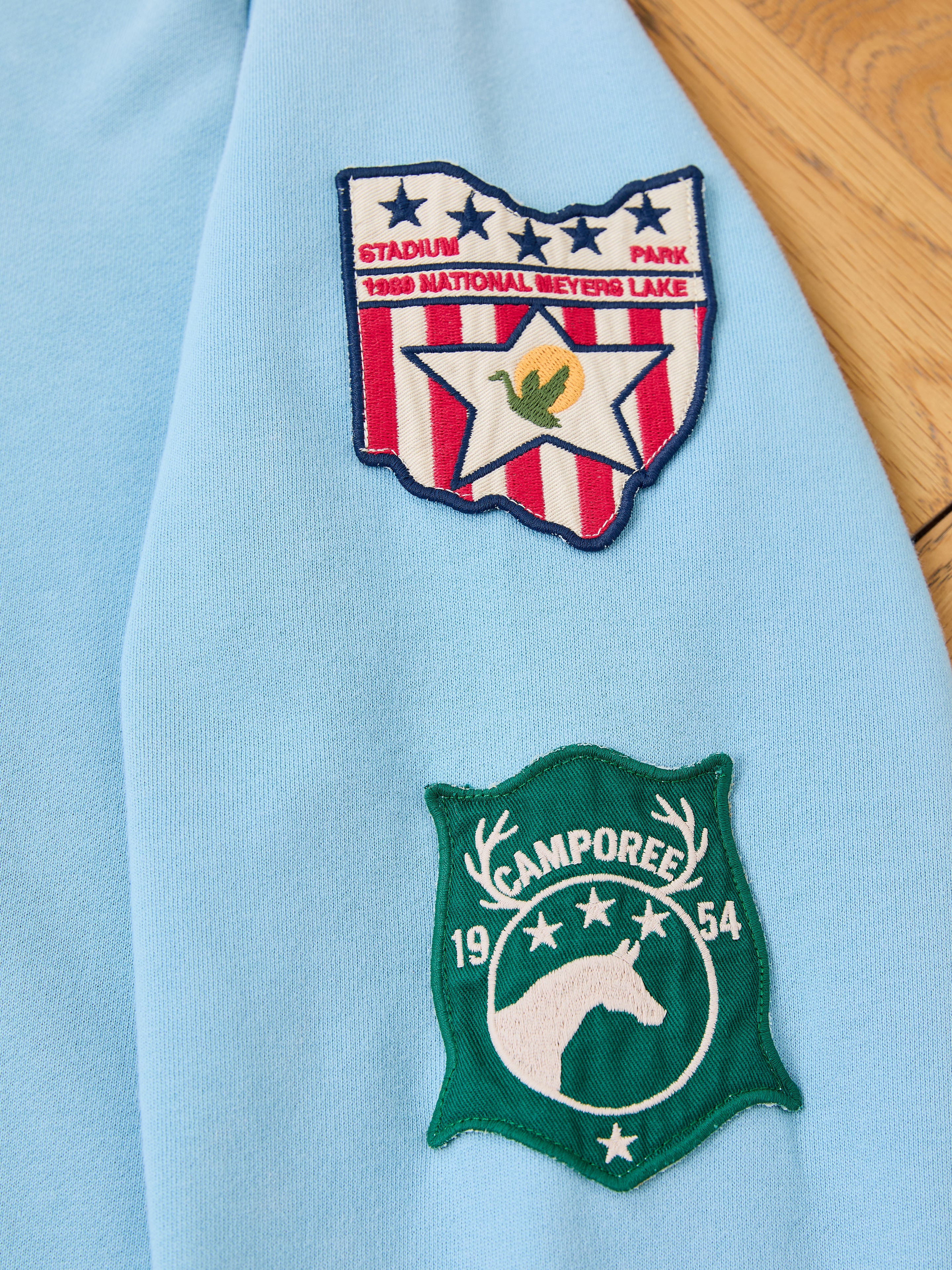The FOUND Horse Line Hoodie features two embroidered patches on soft French Terry cotton: one with "1969 National Meyers Lake" and a star, the other green with a horse and "Camporee 1954." A must-have vintage detail for collectors.
