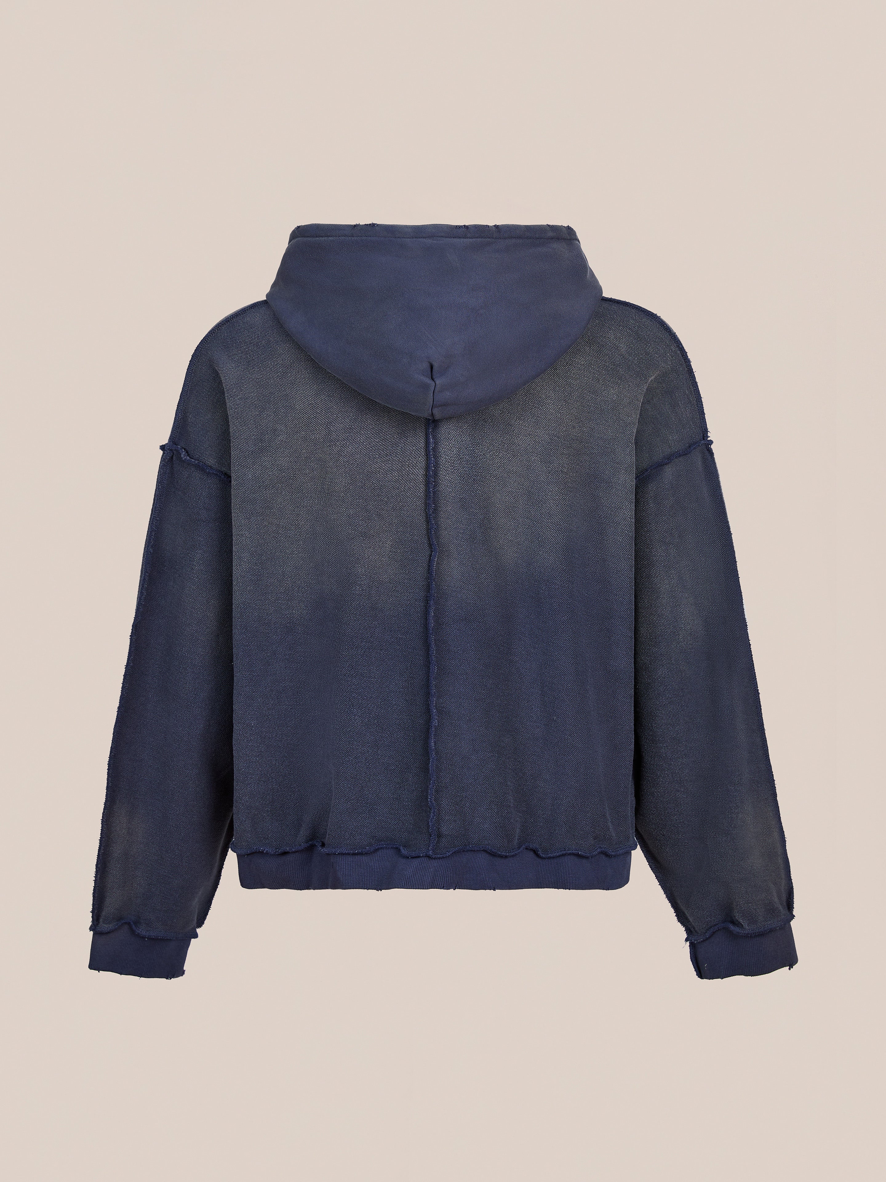 The FOUND Deconstructed Terry Zip Up Hoodie in navy blue features long sleeves, a relaxed fit, exposed seams, and slightly sheer lightweight fabric, shown from the back against a plain background.